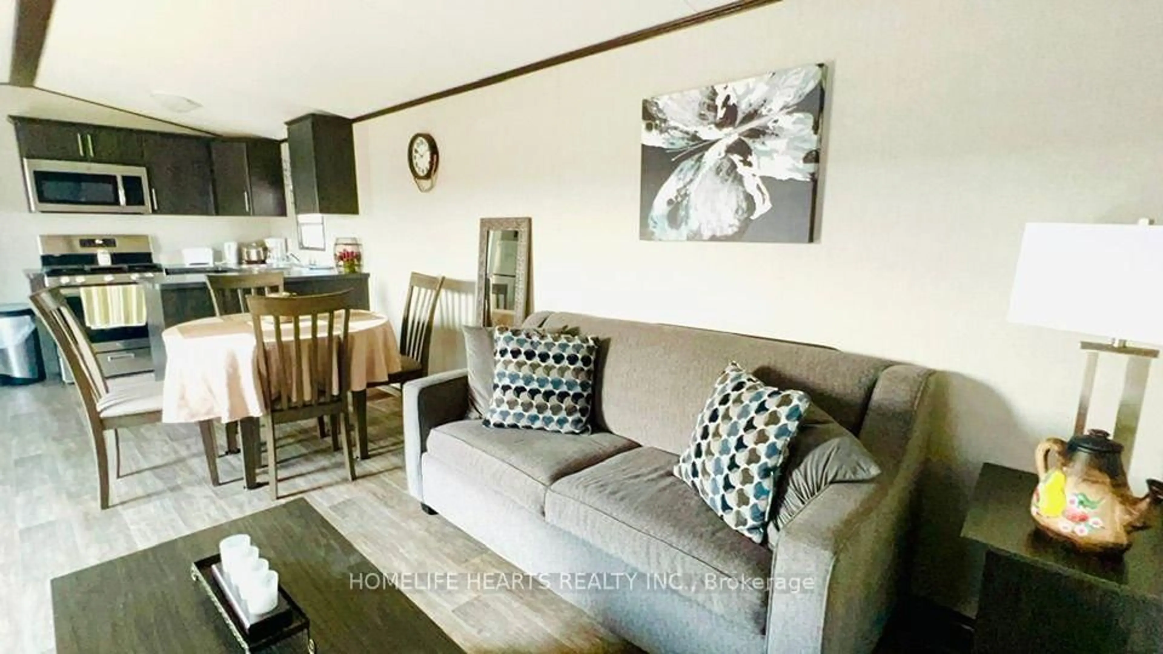 Living room with furniture, wood/laminate floor for 1235 Villiers Line 114 Forest Dr, Otonabee-South Monaghan Ontario K0L 2G0