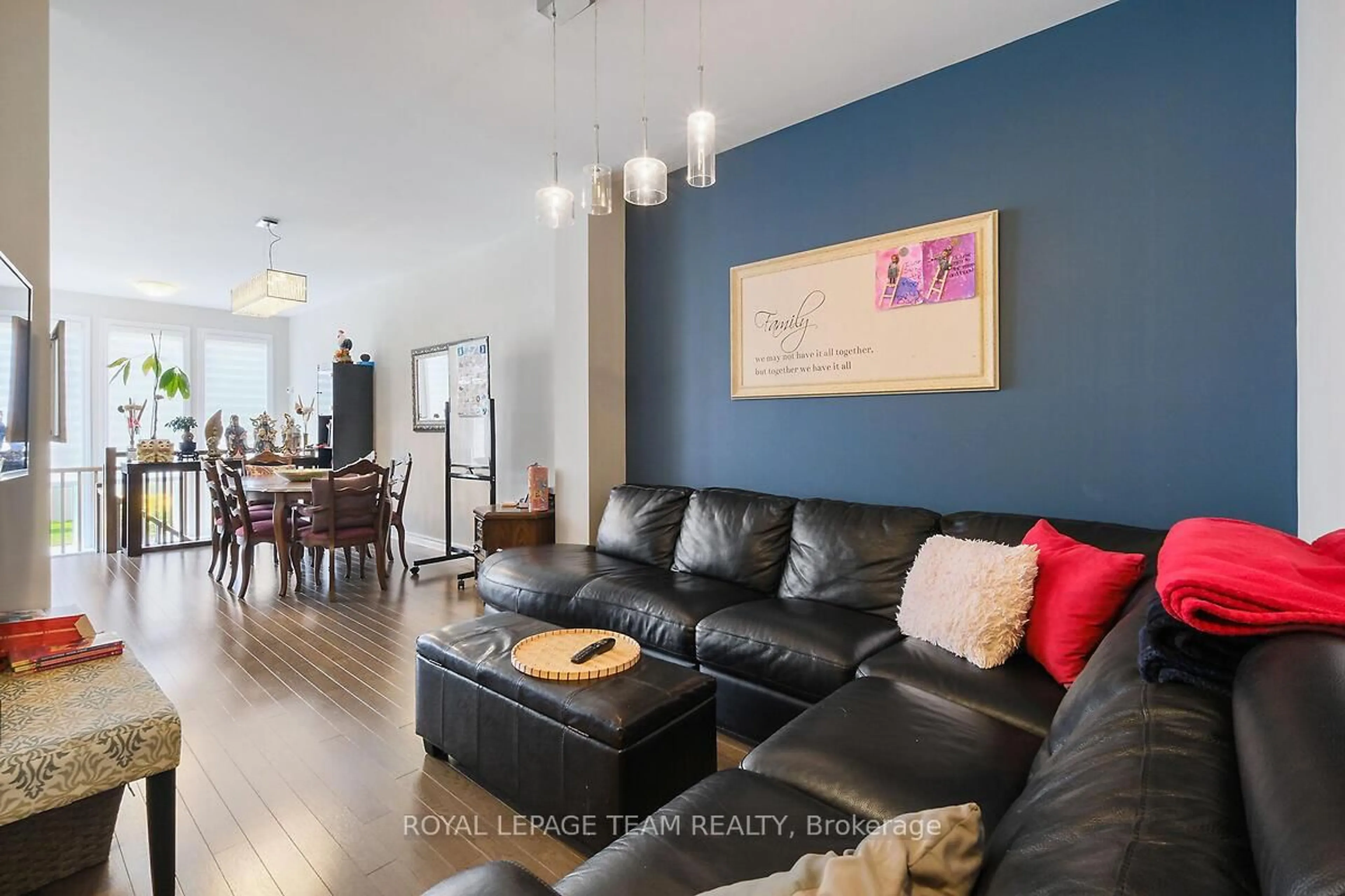 Living room with furniture, wood/laminate floor for 253 Fergus Cres, Ottawa Ontario K2J 3L7