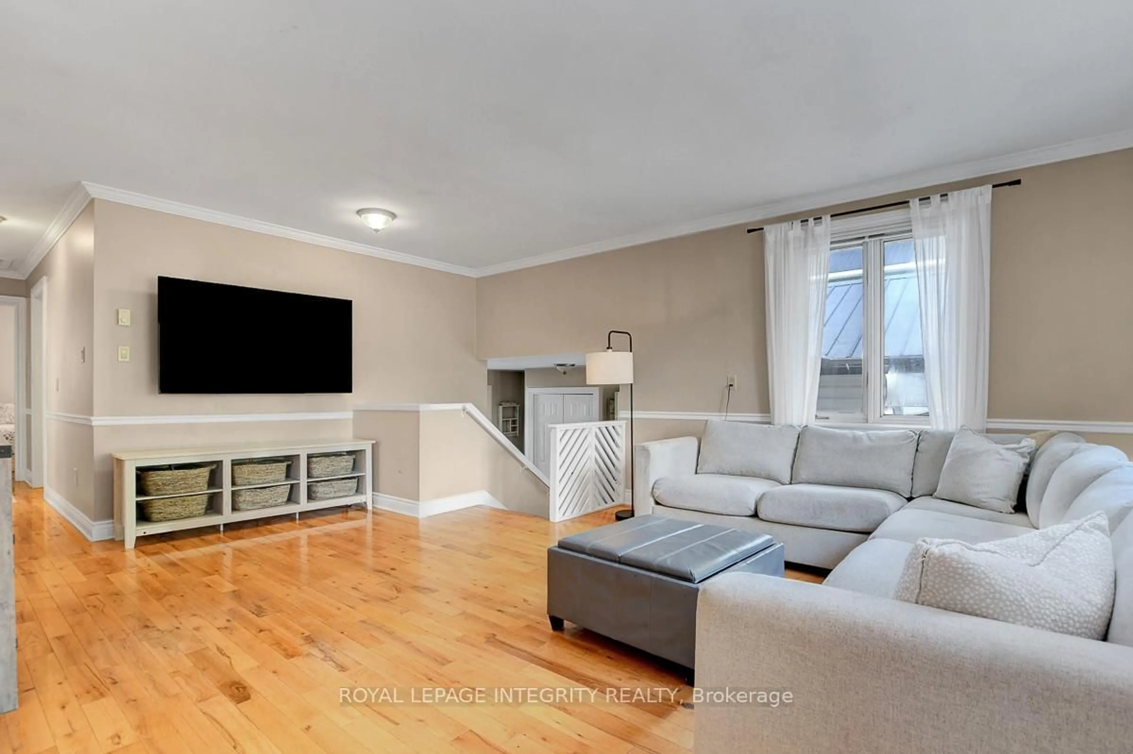Living room with furniture, wood/laminate floor for 34 Bennett St, Edwardsburgh/Cardinal Ontario K0E 1X0
