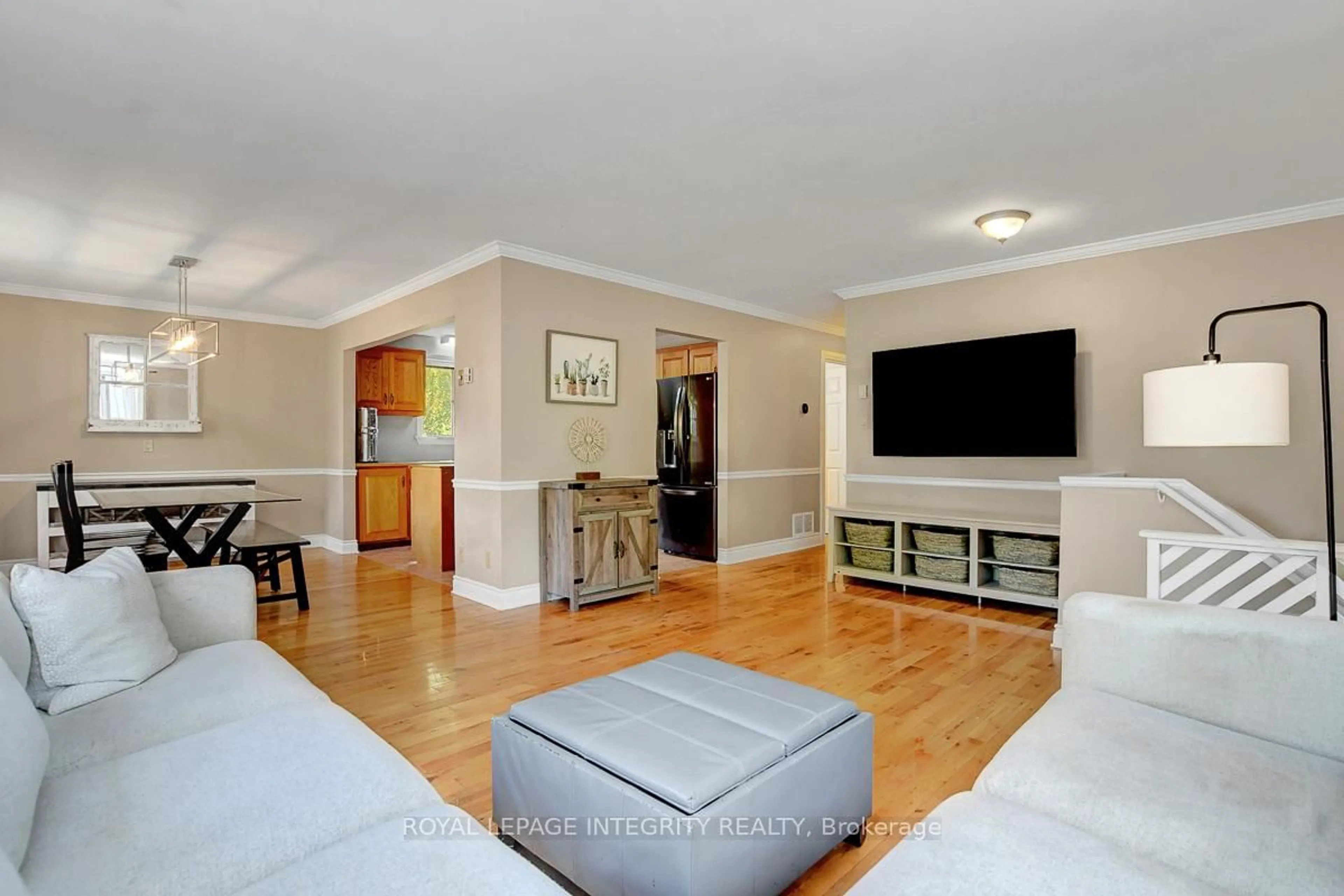 Living room with furniture, wood/laminate floor for 34 Bennett St, Edwardsburgh/Cardinal Ontario K0E 1X0