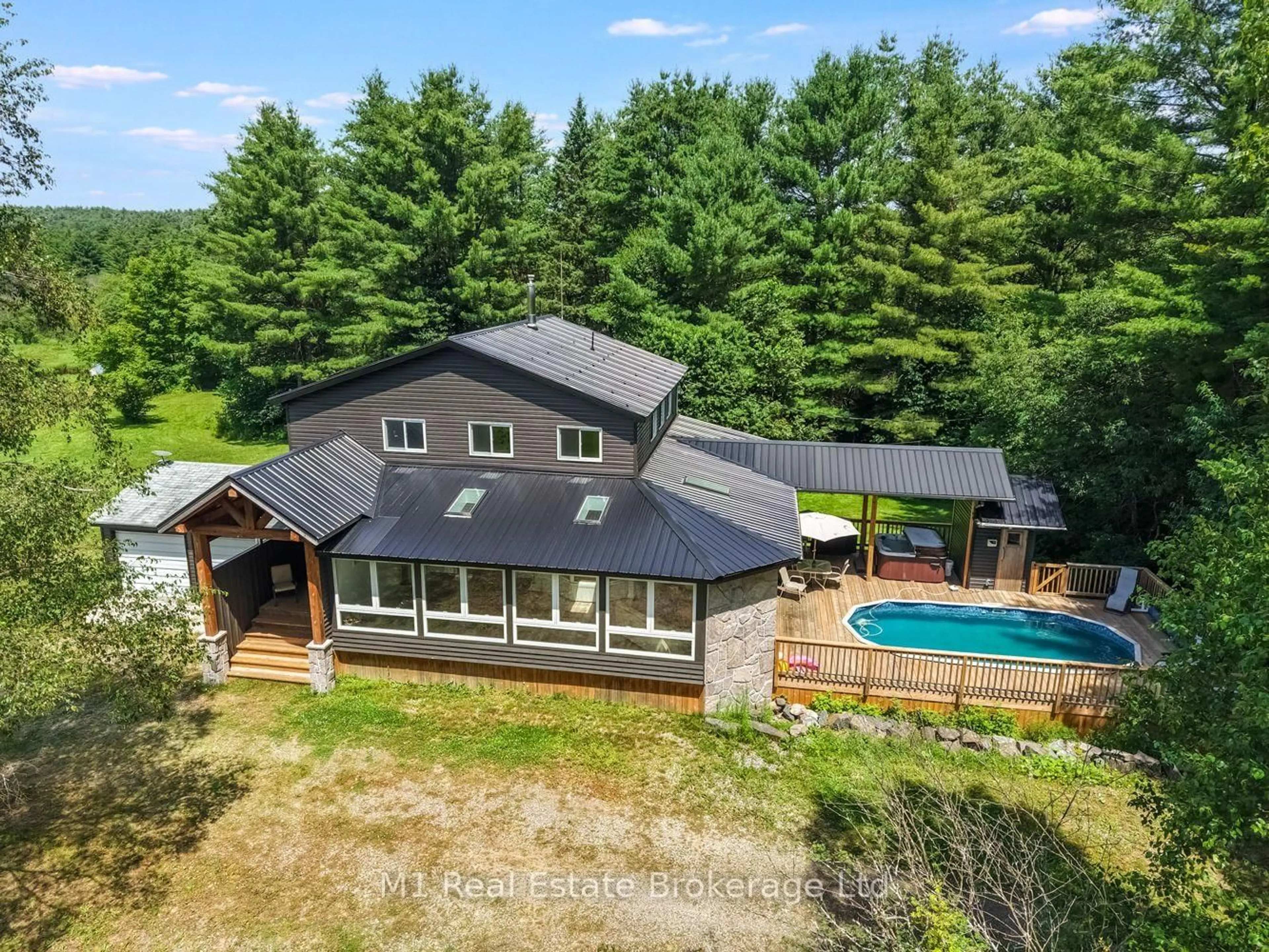 A pic from outside/outdoor area/front of a property/back of a property/a pic from drone, water/lake/river/ocean view for 259 Nippissing Rd, Seguin Ontario P0C 1J0