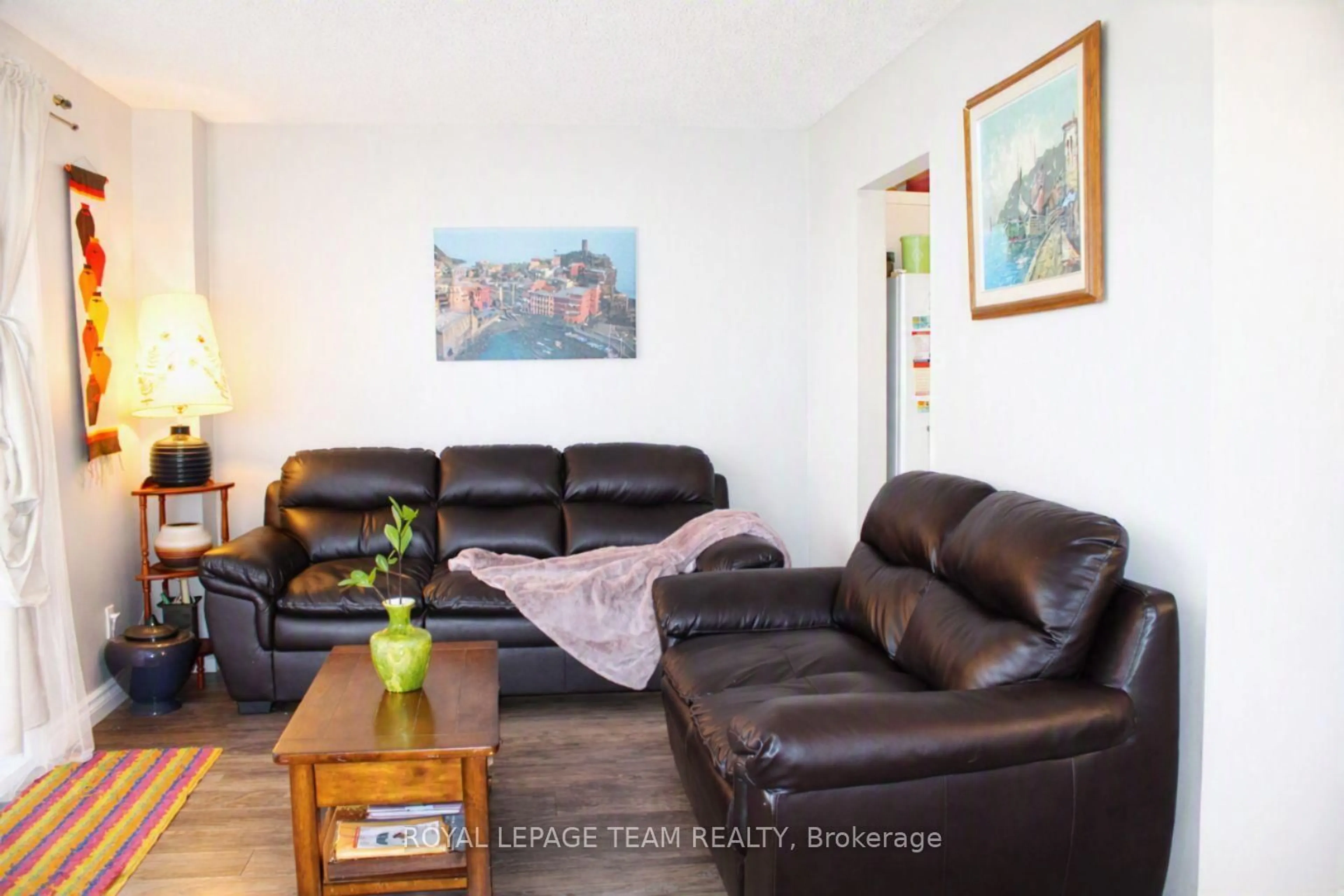 Living room with furniture, wood/laminate floor for 503 Sidney Dr, Ottawa Ontario K4A 2W6