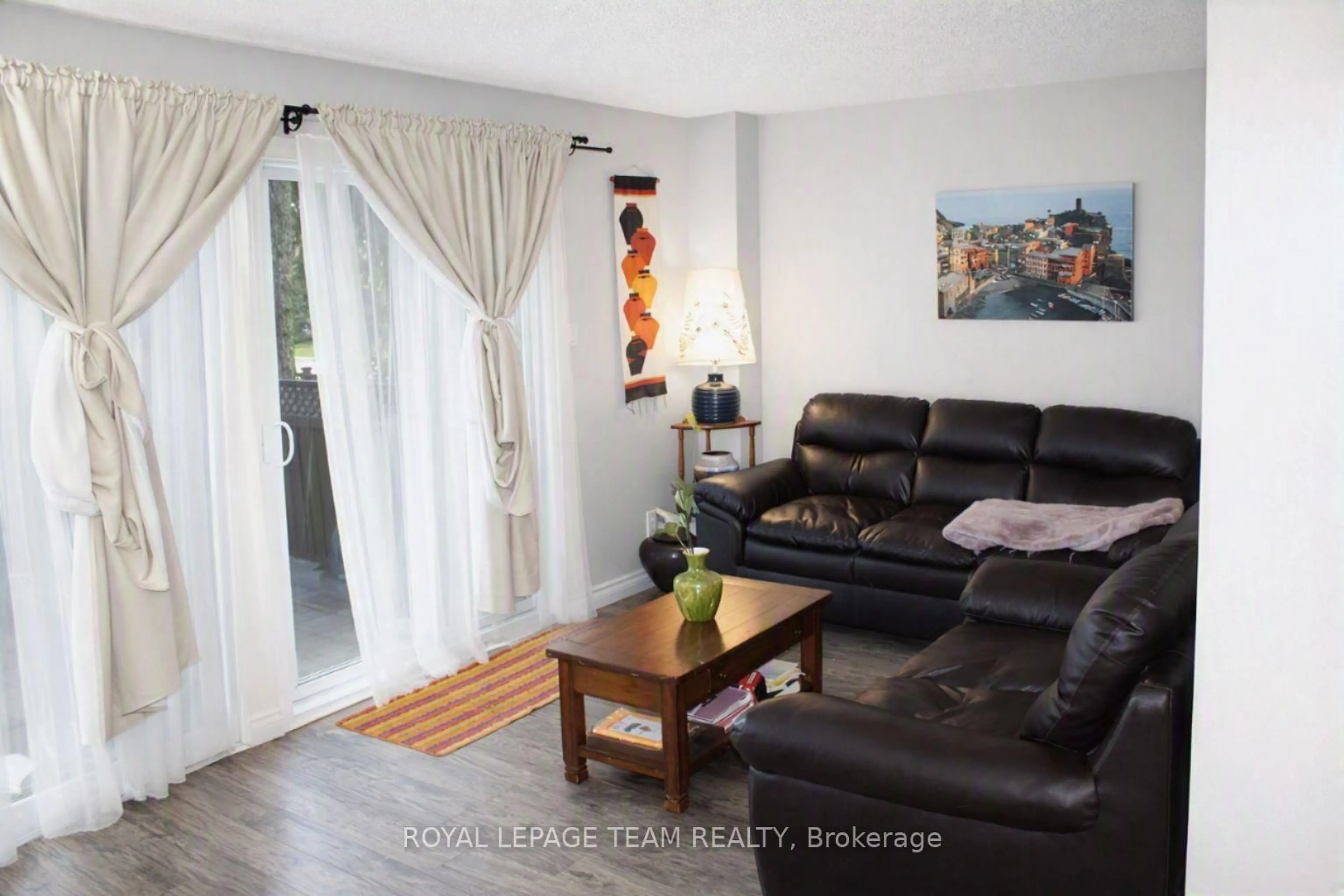 Living room with furniture, wood/laminate floor for 503 Sidney Dr, Ottawa Ontario K4A 2W6