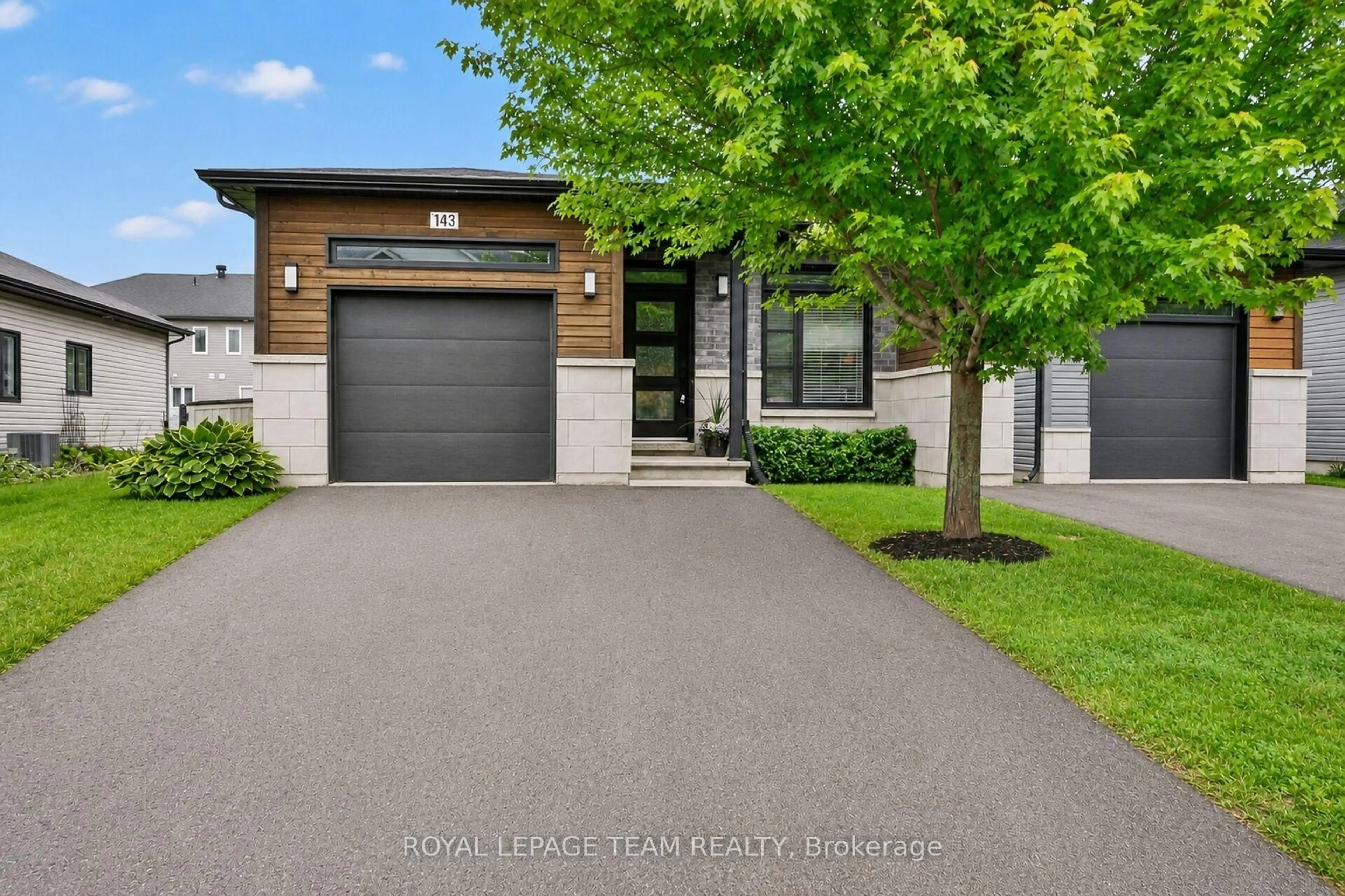 Home with brick exterior material, street for 143 St Malo Pl, Russell Ontario K0A 1W0