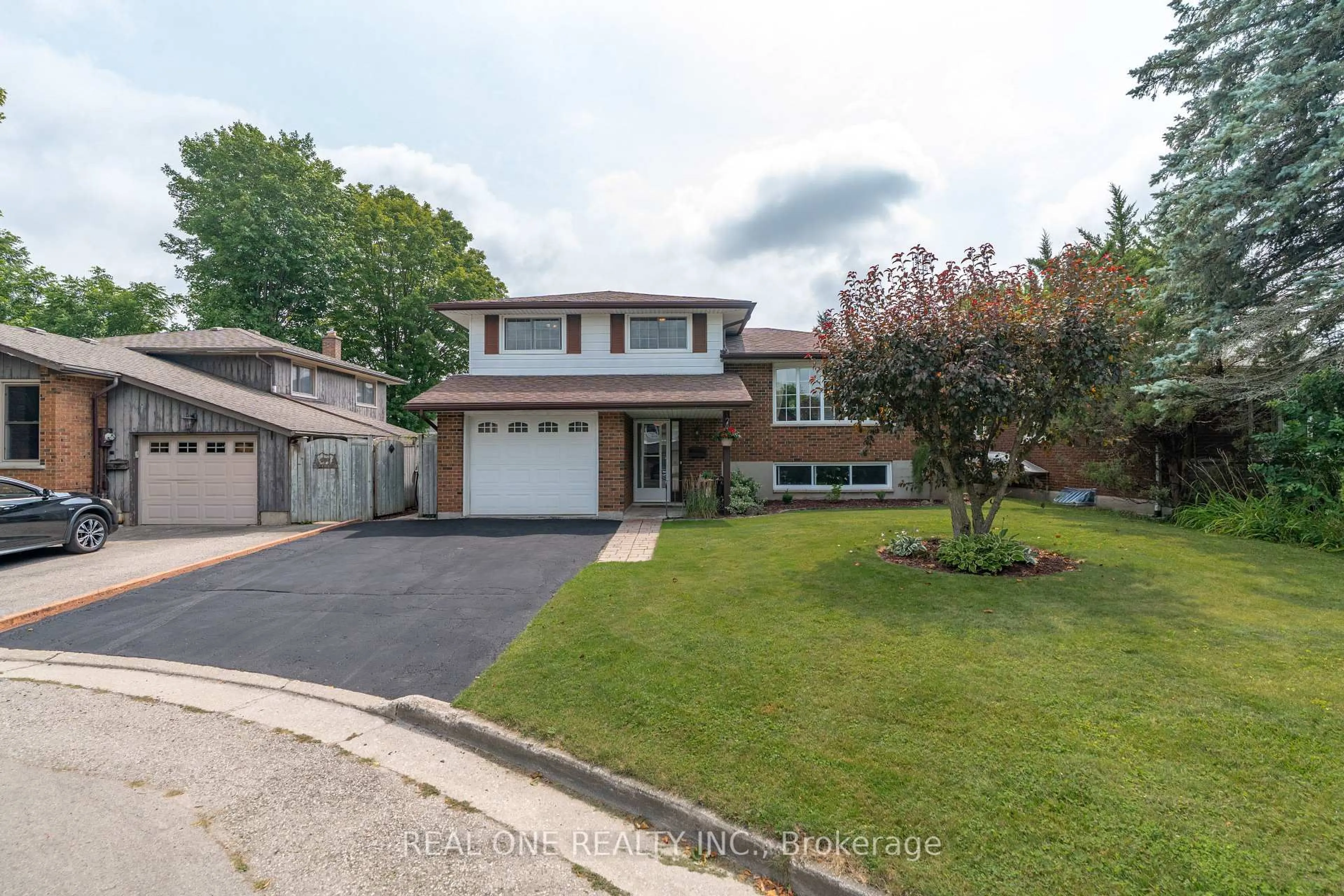 Home with brick exterior material, street for 111 Glenburnie Dr, Guelph Ontario N1E 4C9