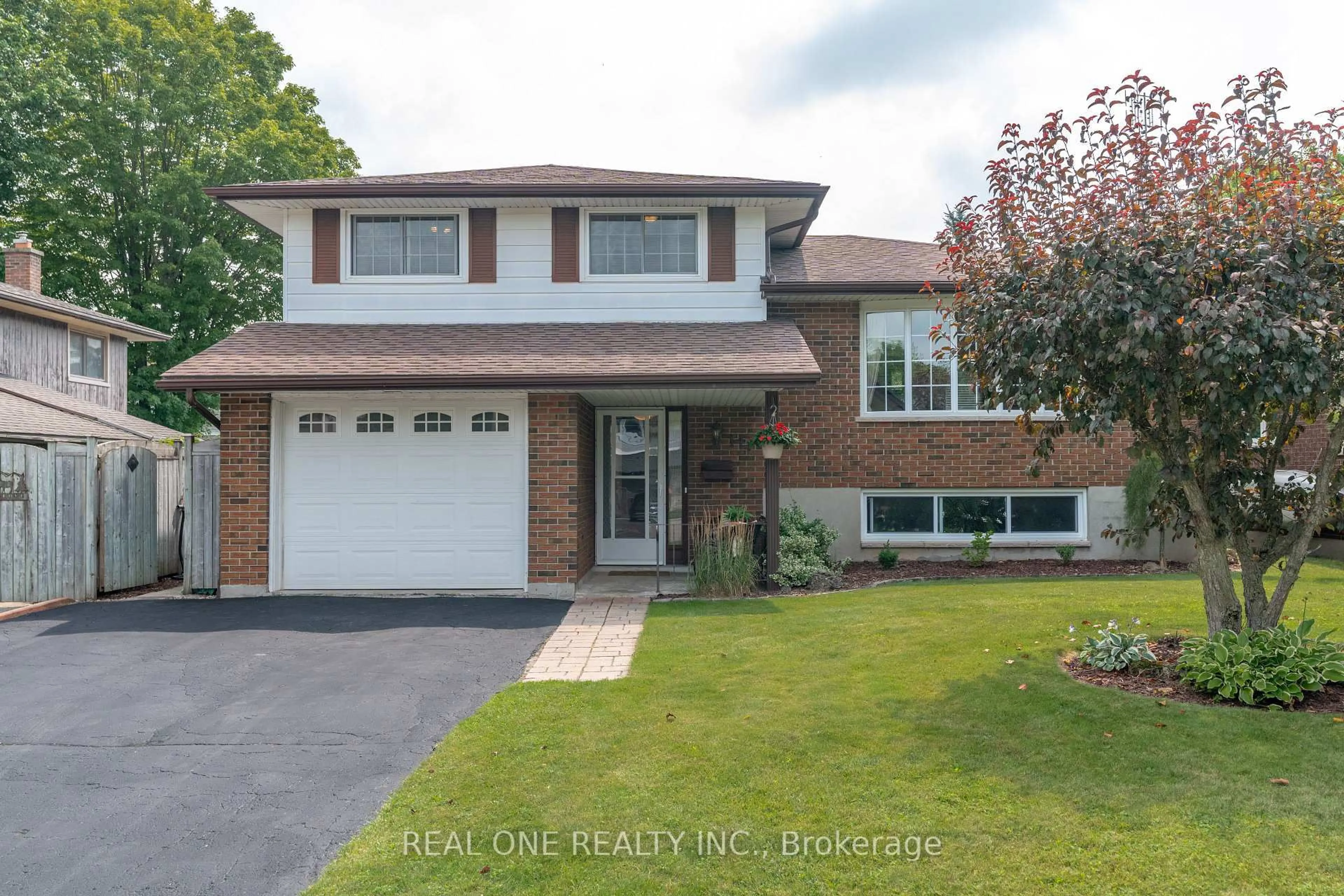 Home with brick exterior material, street for 111 Glenburnie Dr, Guelph Ontario N1E 4C9