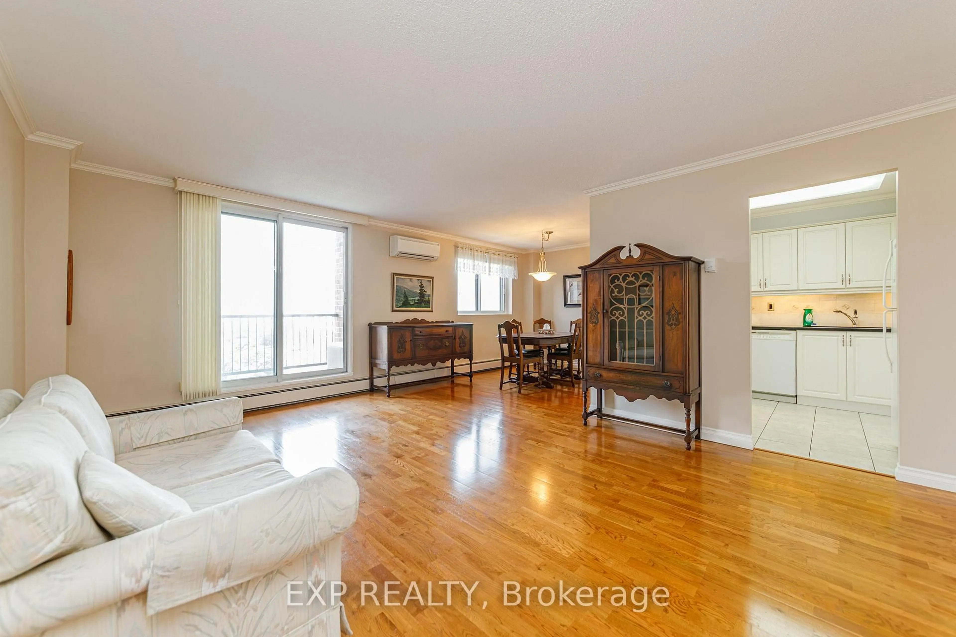 Living room with furniture, wood/laminate floor for 2650 Southvale Cres #508, Ottawa Ontario K1B 4S9