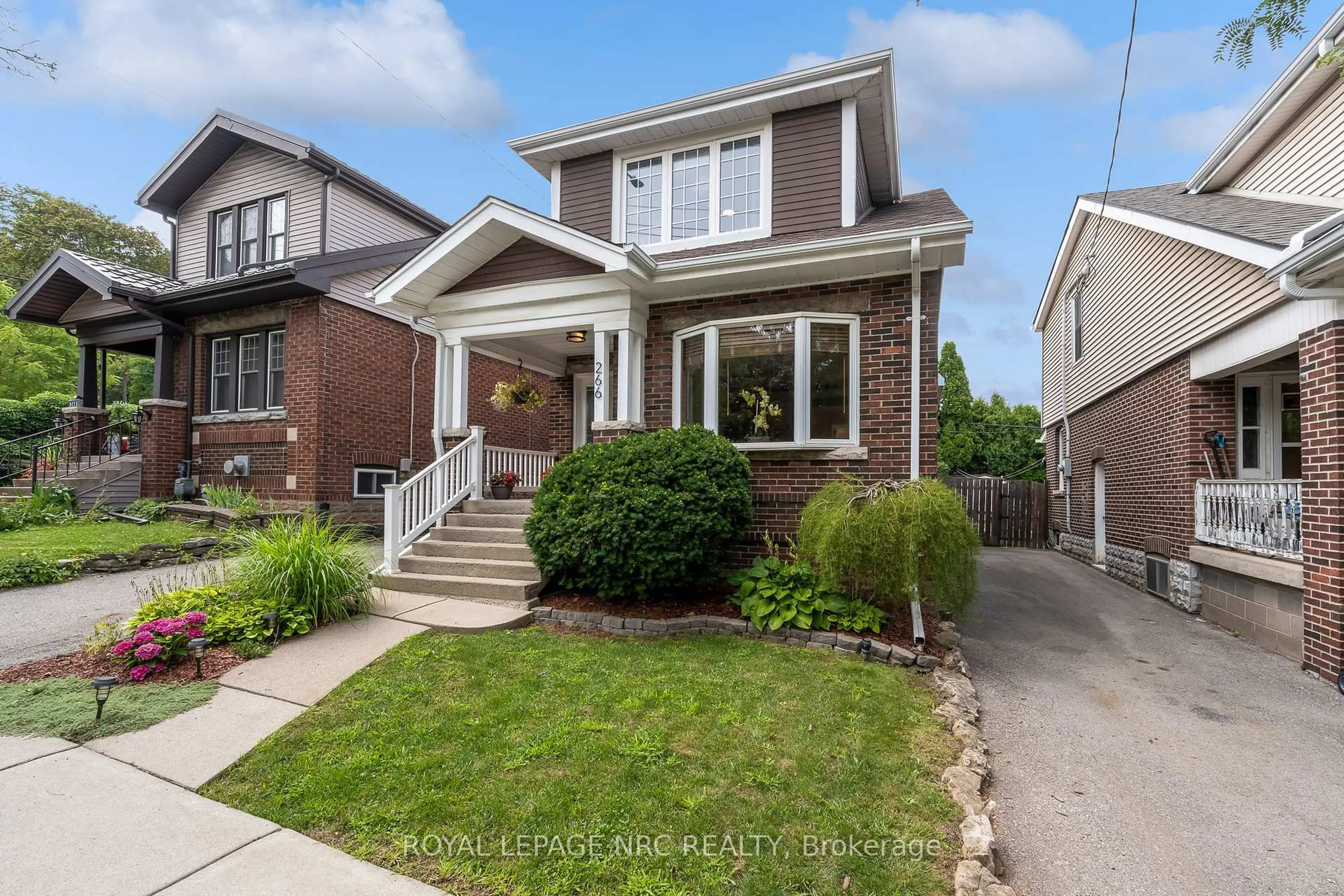 Home with brick exterior material, street for 266 London St, Hamilton Ontario L8K 2H2