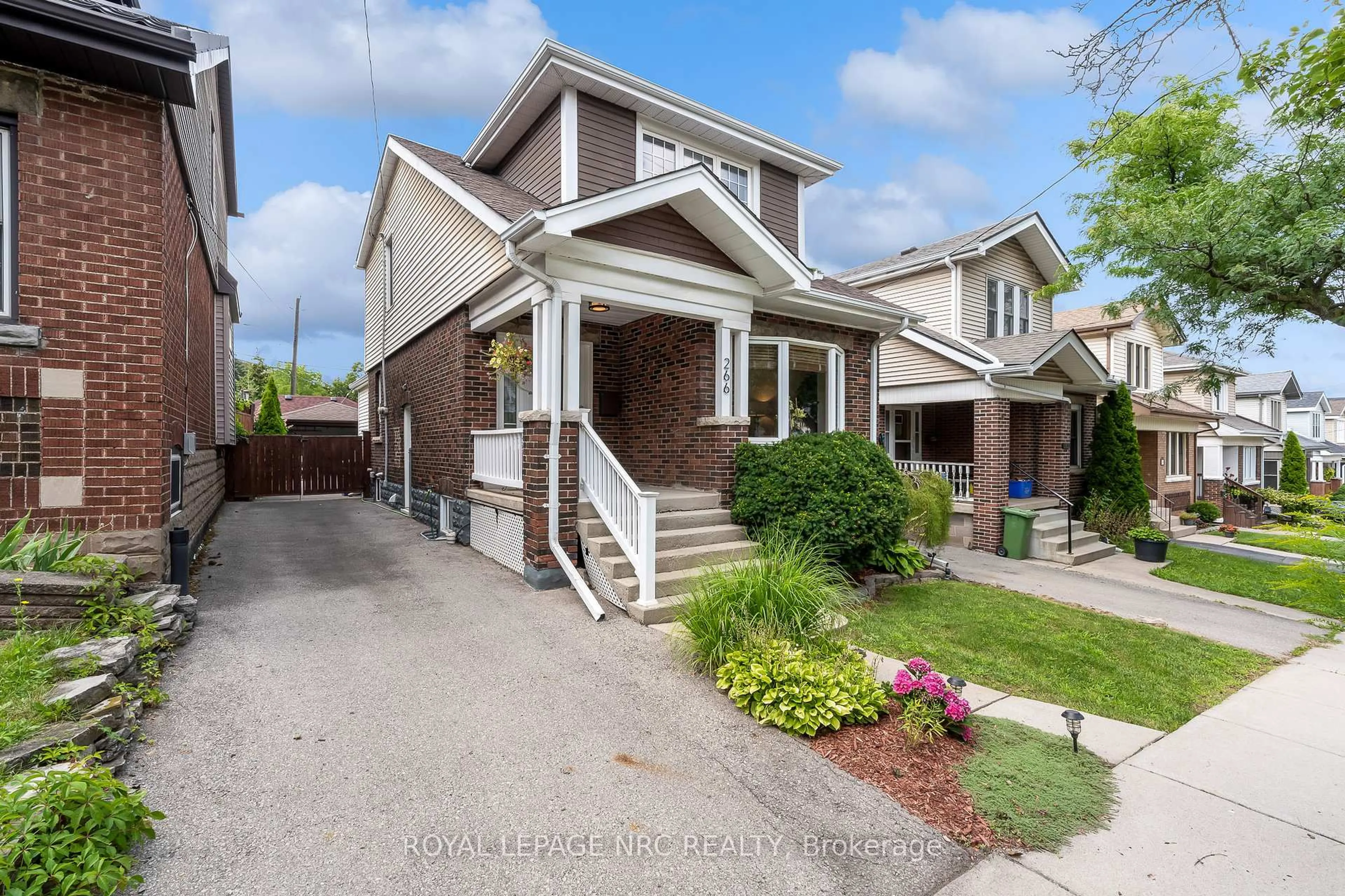 Home with brick exterior material, street for 266 London St, Hamilton Ontario L8K 2H2