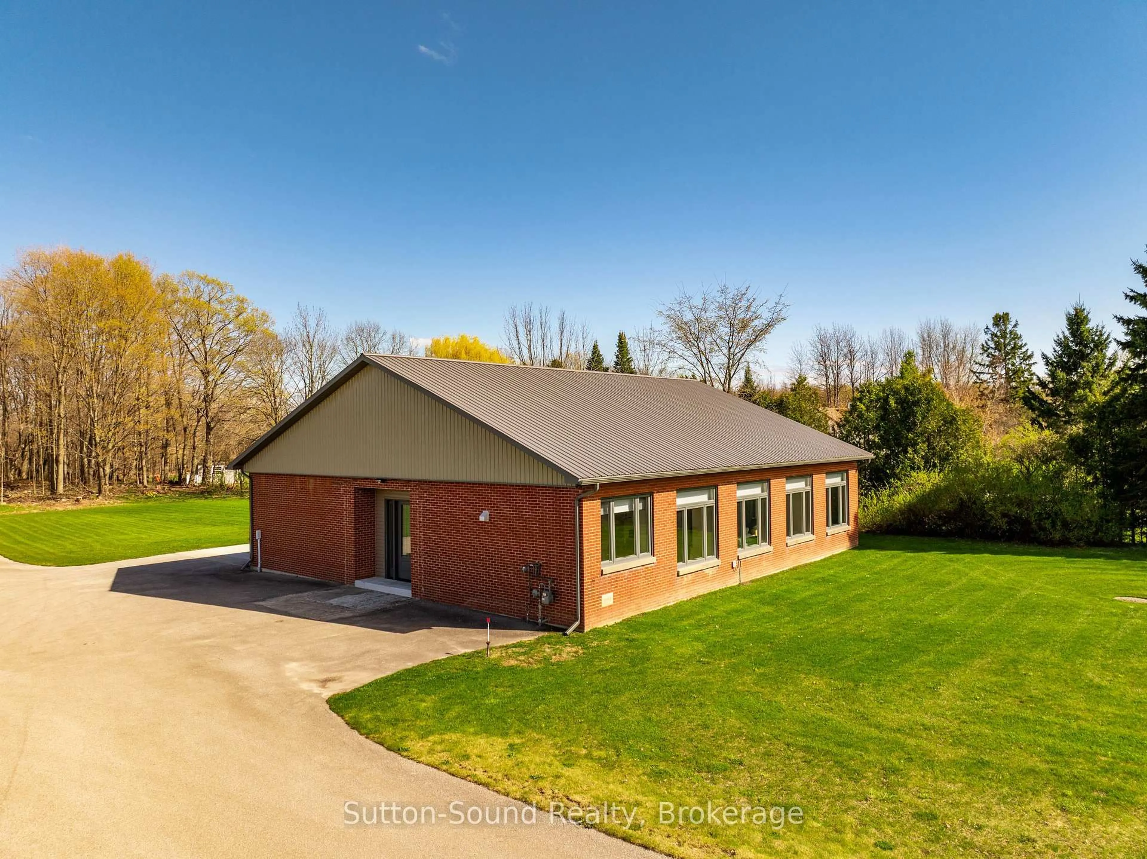A pic from outside/outdoor area/front of a property/back of a property/a pic from drone, building for 318837 Grey Rd 1 Rd, Georgian Bluffs Ontario N4K 5N4