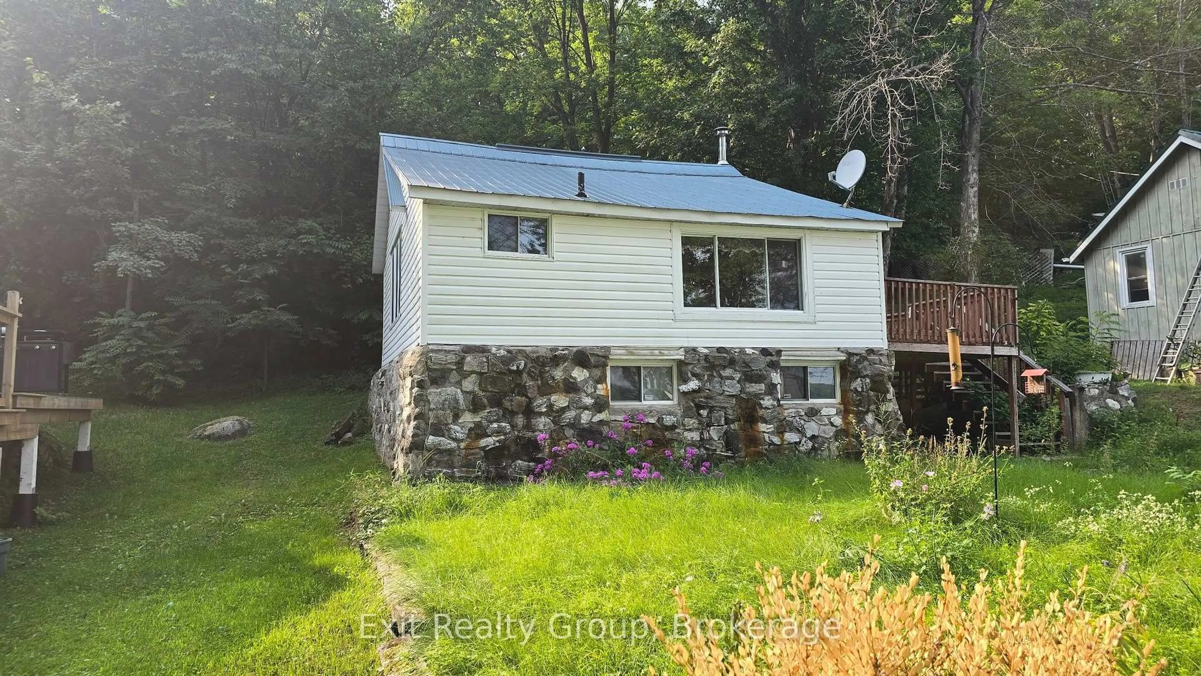 A pic from outside/outdoor area/front of a property/back of a property/a pic from drone, unknown for 82 Ballam Lane #B, Madoc Ontario K0K 2K0