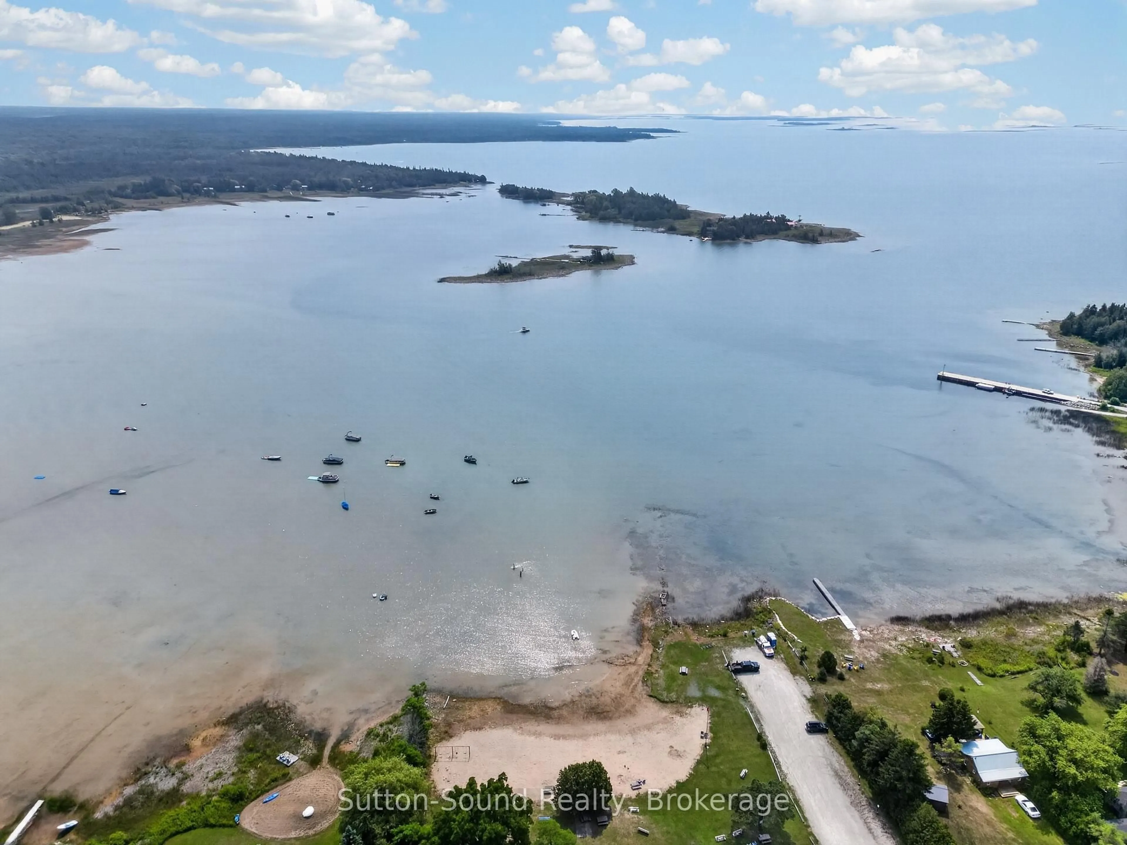 A pic from outside/outdoor area/front of a property/back of a property/a pic from drone, water/lake/river/ocean view for 24 Isabella St, South Bruce Peninsula Ontario N0H 2T0