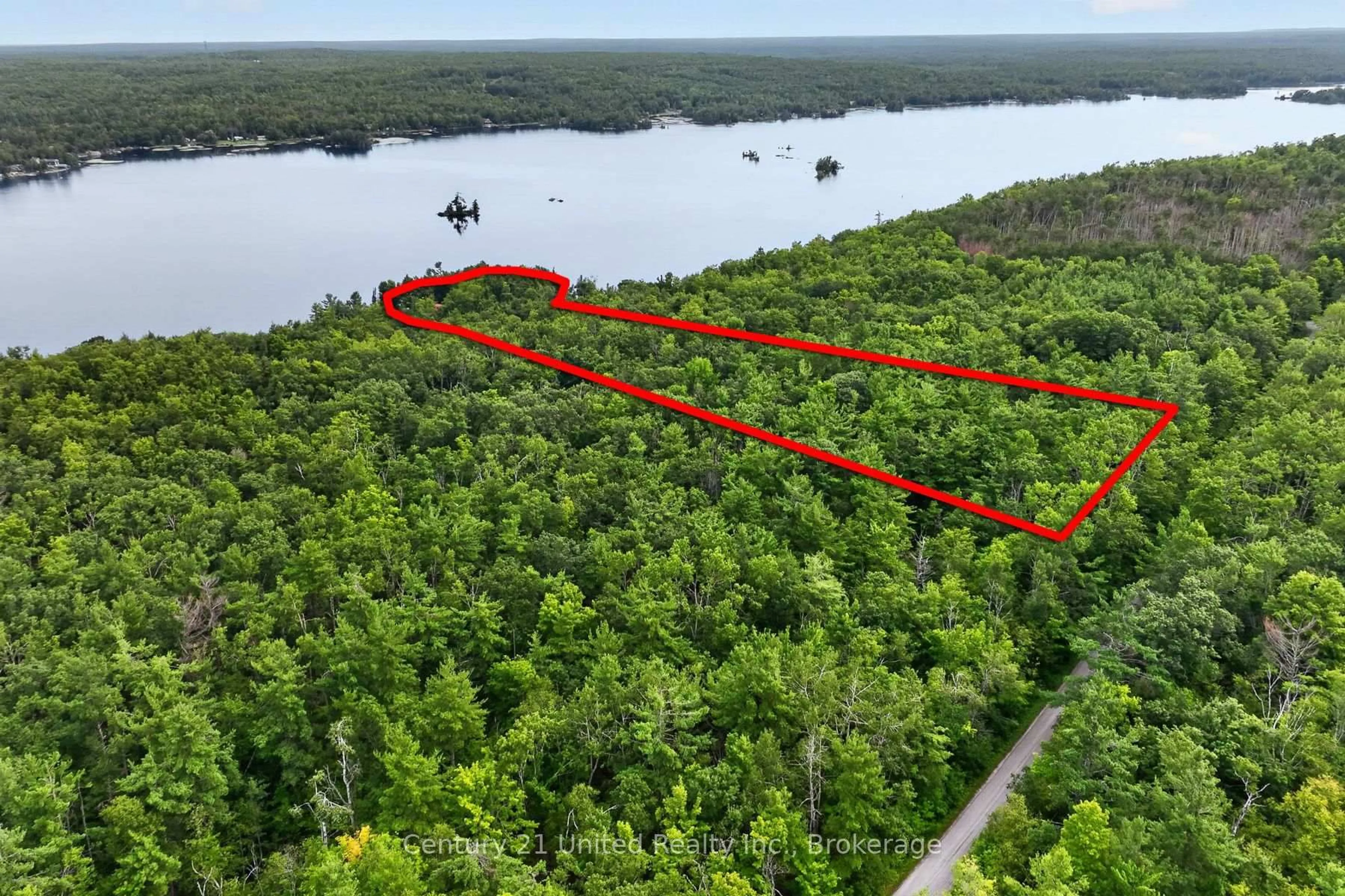 A pic from outside/outdoor area/front of a property/back of a property/a pic from drone, water/lake/river/ocean view for 2450 Victoria Springs Lane, Selwyn Ontario K0L 2H0