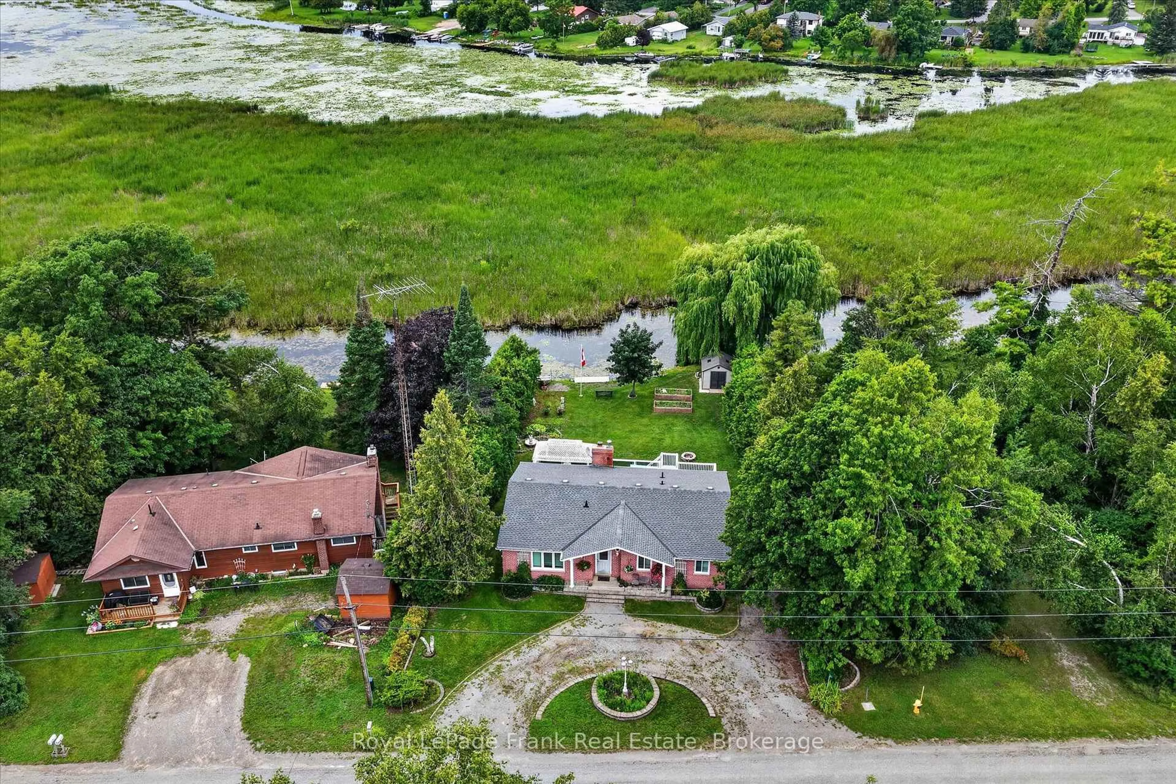 A pic from outside/outdoor area/front of a property/back of a property/a pic from drone, unknown for 34 Birch Point Dr, Kawartha Lakes Ontario K0L 1T0