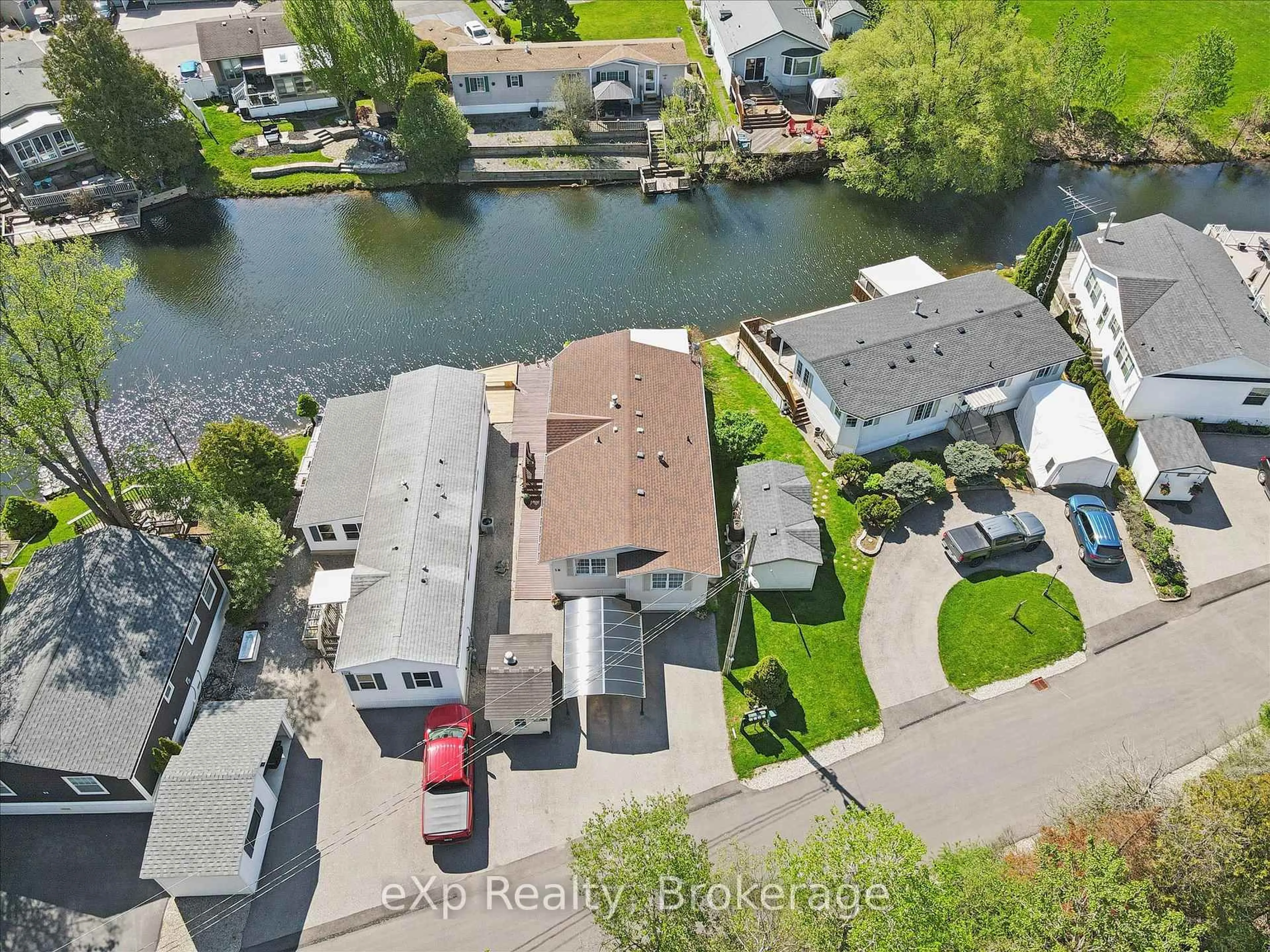 A pic from outside/outdoor area/front of a property/back of a property/a pic from drone, water/lake/river/ocean view for 18 Jasper Heights Private, Puslinch Ontario N0B 2C0