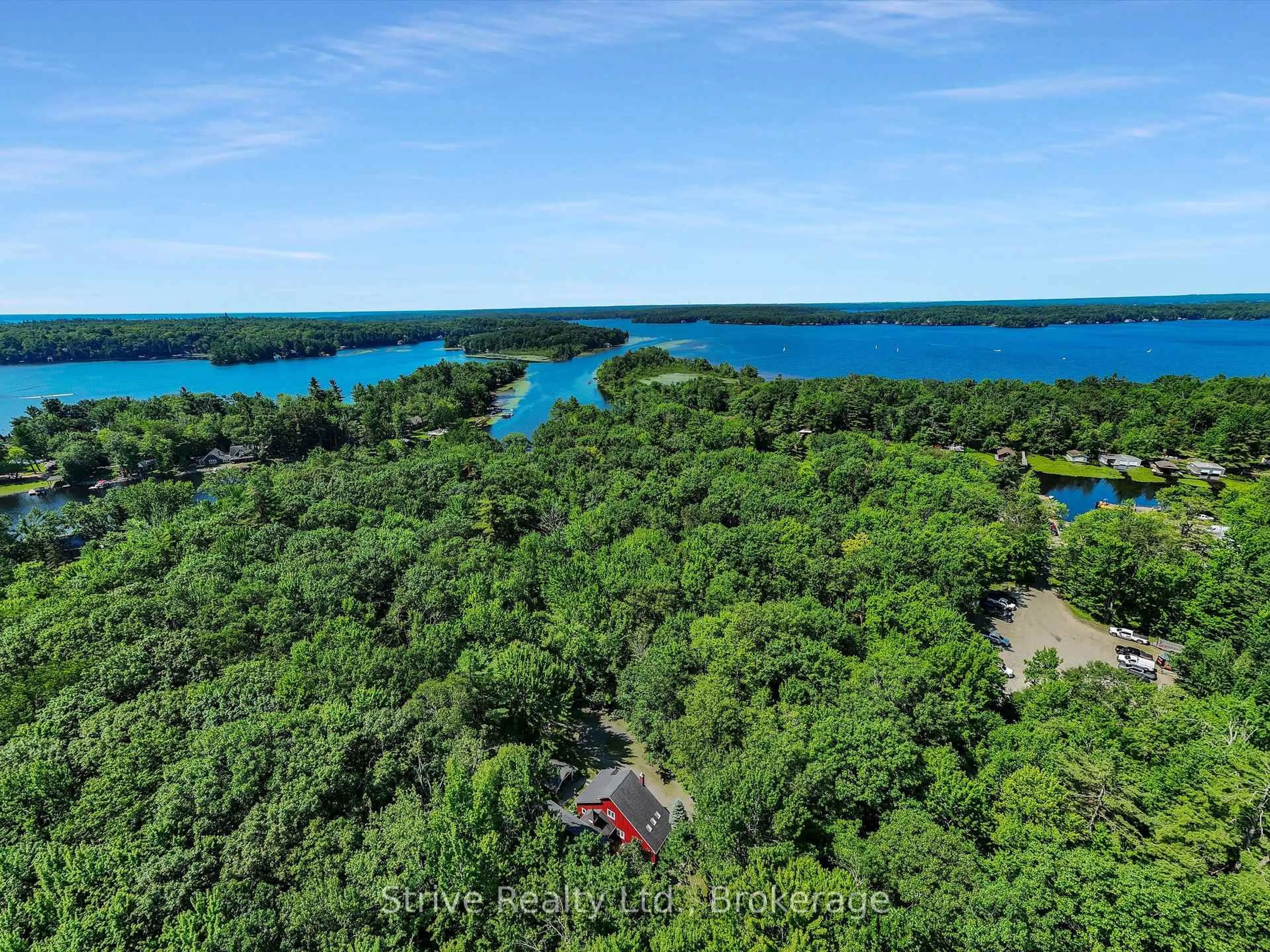A pic from outside/outdoor area/front of a property/back of a property/a pic from drone, water/lake/river/ocean view for 1035 George Rd, Bracebridge Ontario P1L 1W8