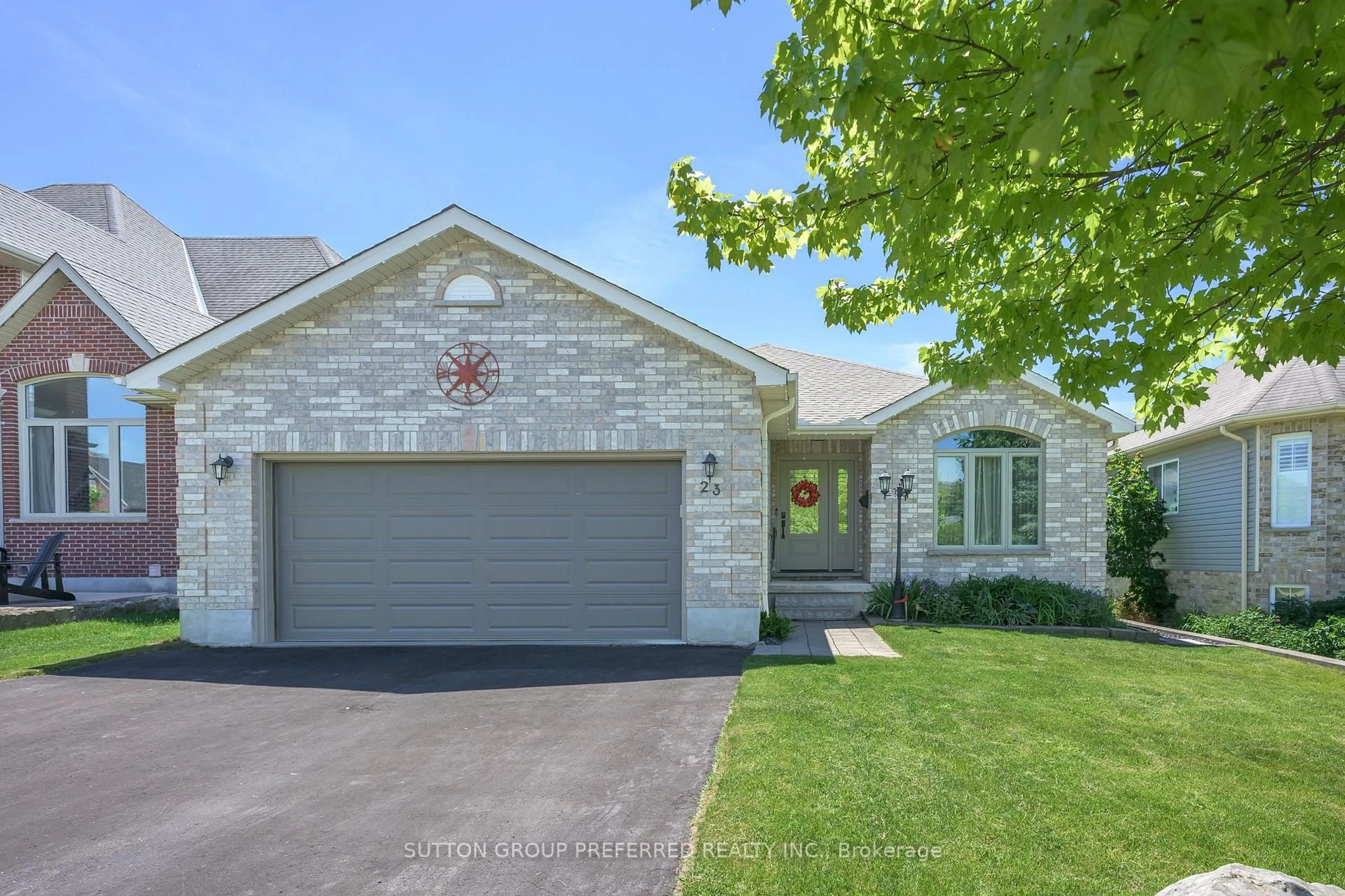 Home with brick exterior material, street for 23 Wood Lily Lane, Middlesex Centre Ontario N0M 2A0