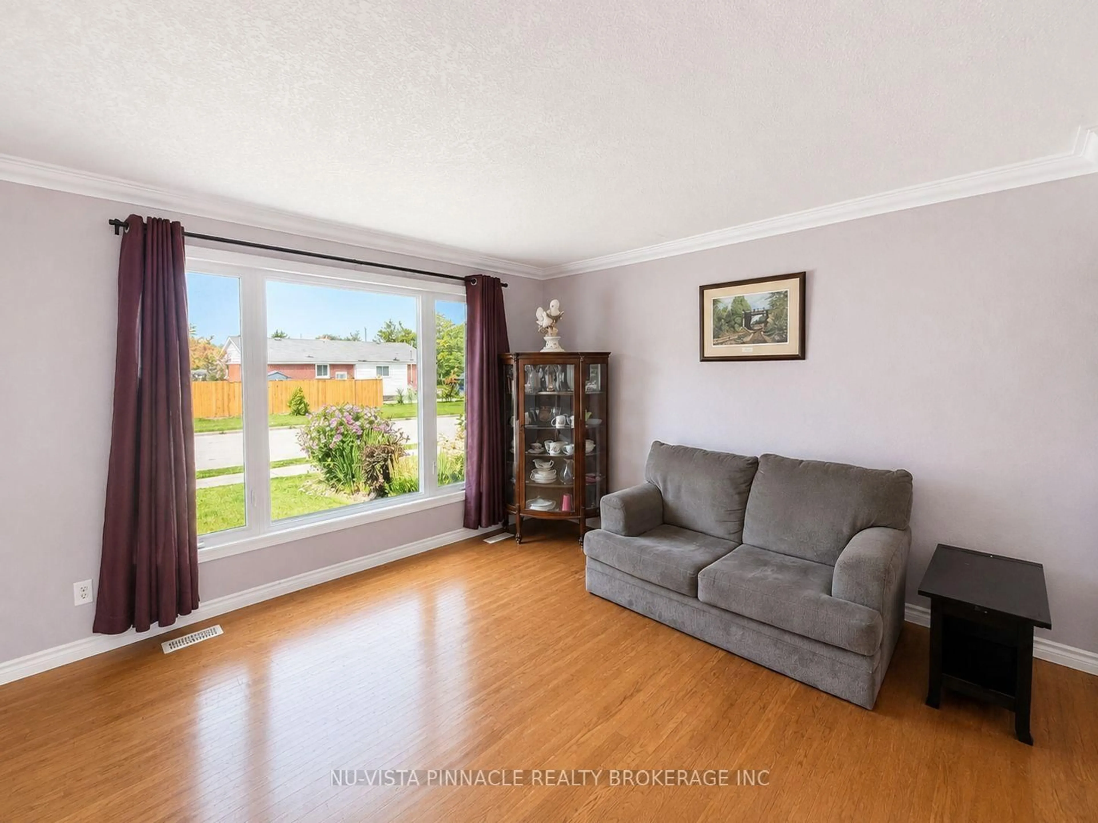 Living room with furniture, wood/laminate floor for 15 Gregory Pl, St. Thomas Ontario N5R 4S4