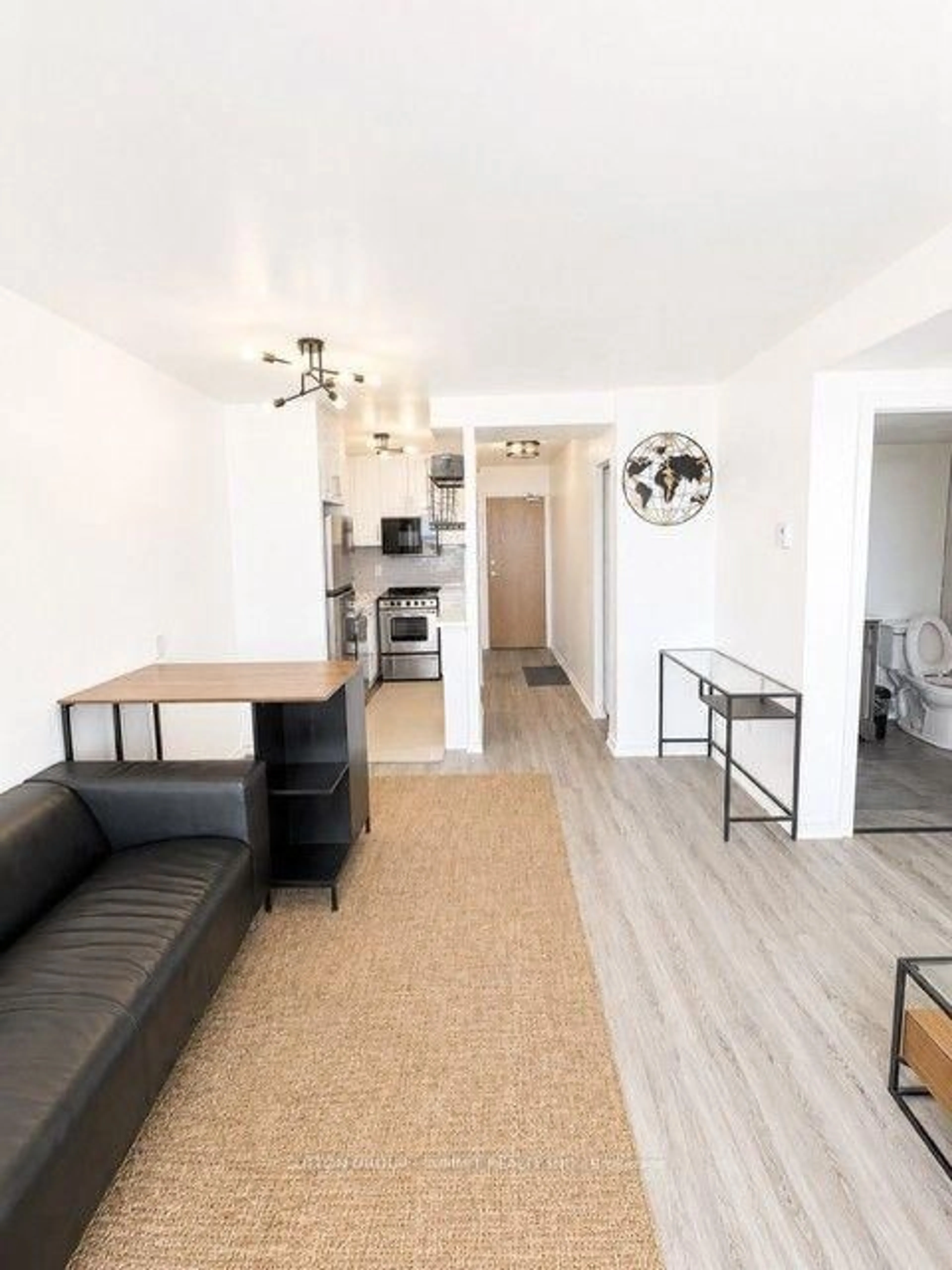 Living room with furniture, wood/laminate floor for 150 Charlton Ave #1201, Hamilton Ontario L8N 3X3