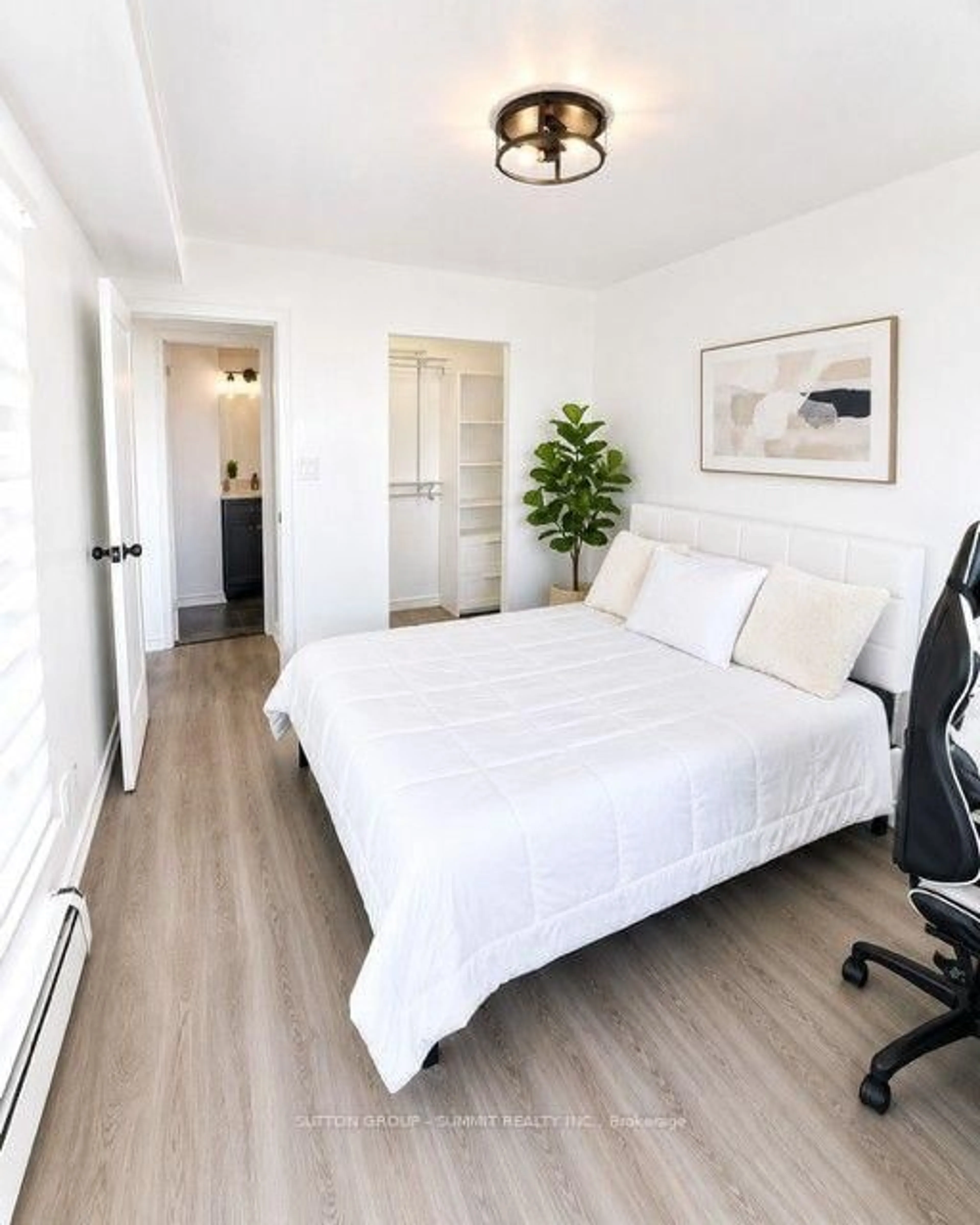 Bedroom with bed, wood/laminate floor for 150 Charlton Ave #1201, Hamilton Ontario L8N 3X3