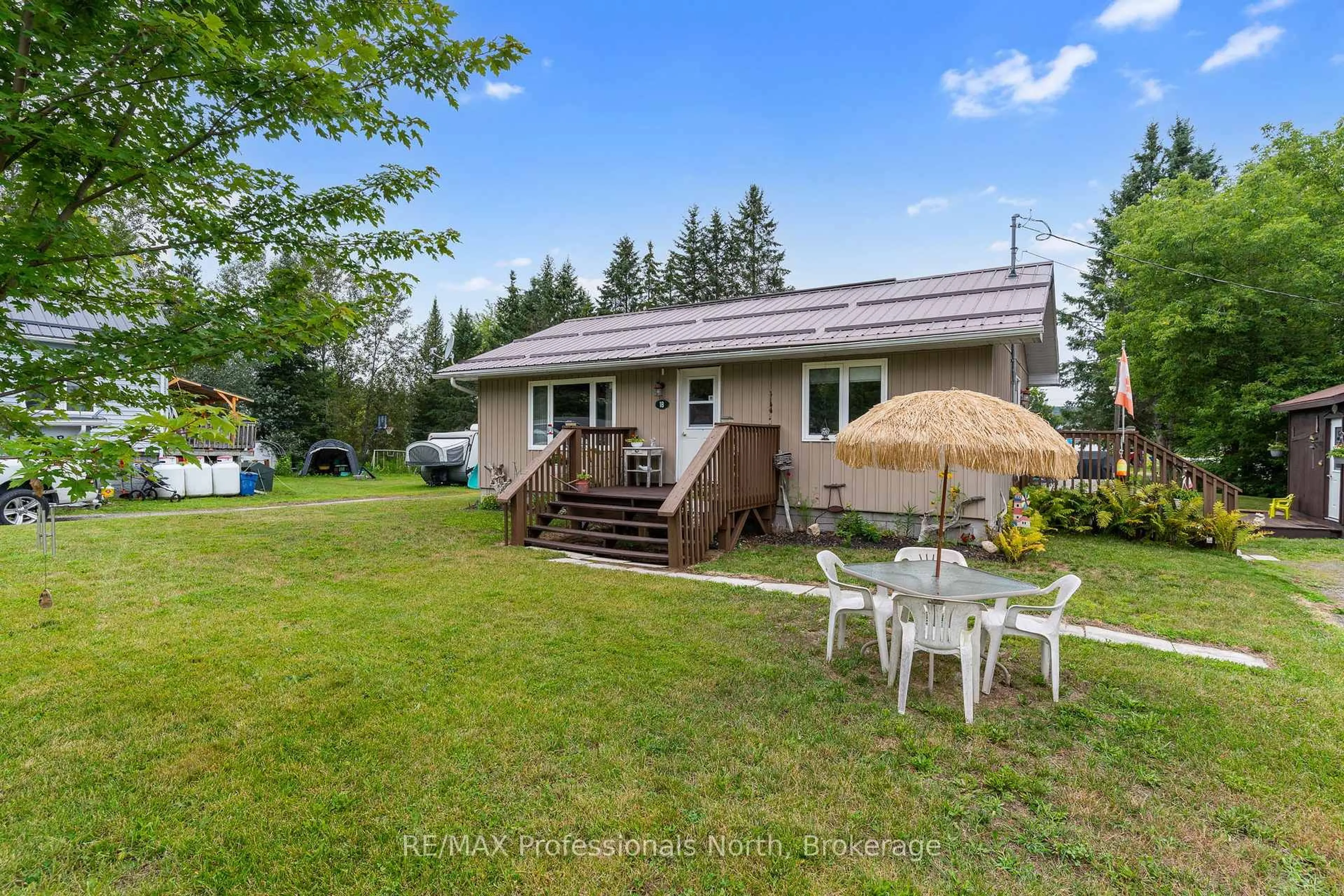 A pic from outside/outdoor area/front of a property/back of a property/a pic from drone, water/lake/river/ocean view for 1B Lyons St, Minden Hills Ontario K0M 2K0