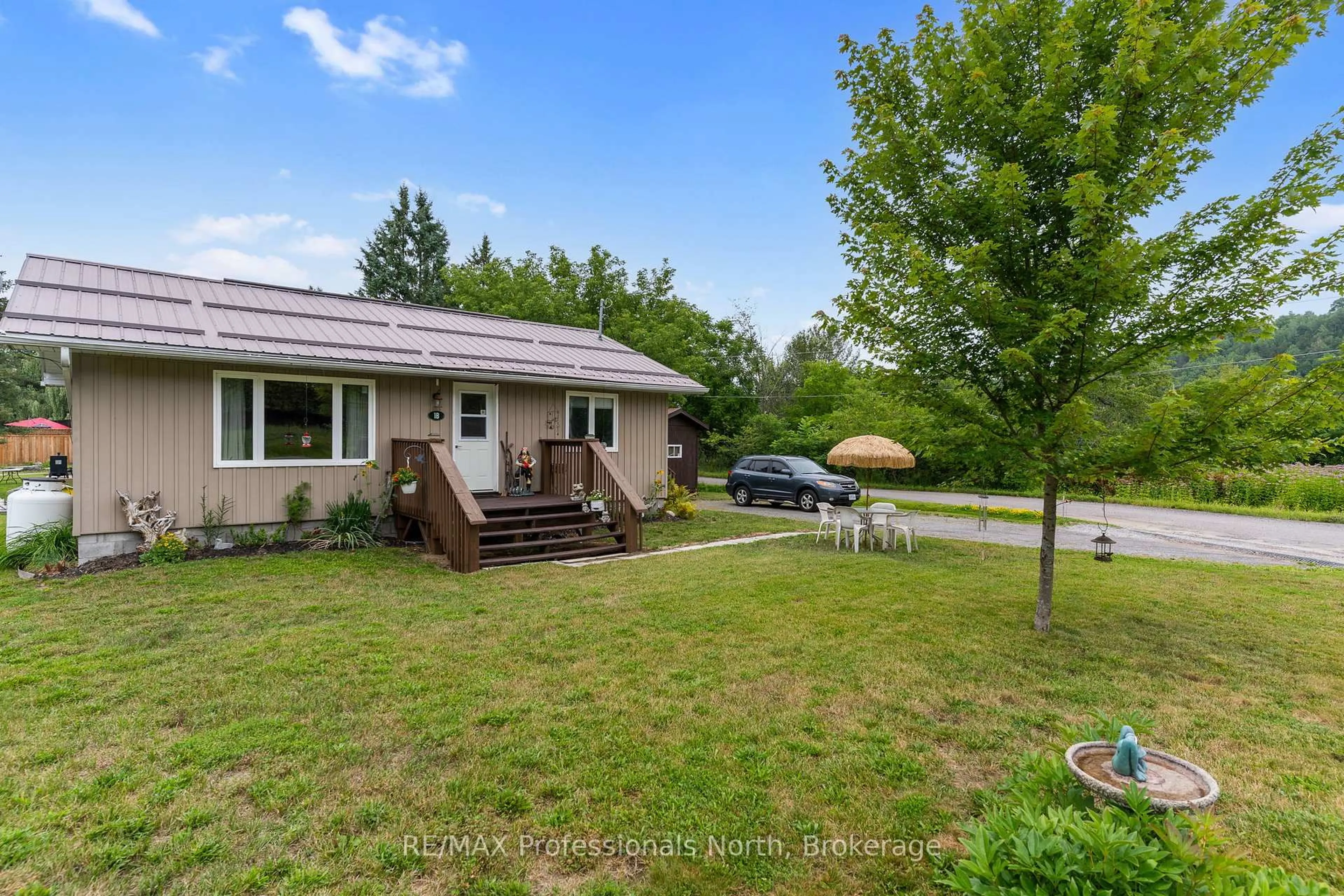 A pic from outside/outdoor area/front of a property/back of a property/a pic from drone, unknown for 1B Lyons St, Minden Hills Ontario K0M 2K0