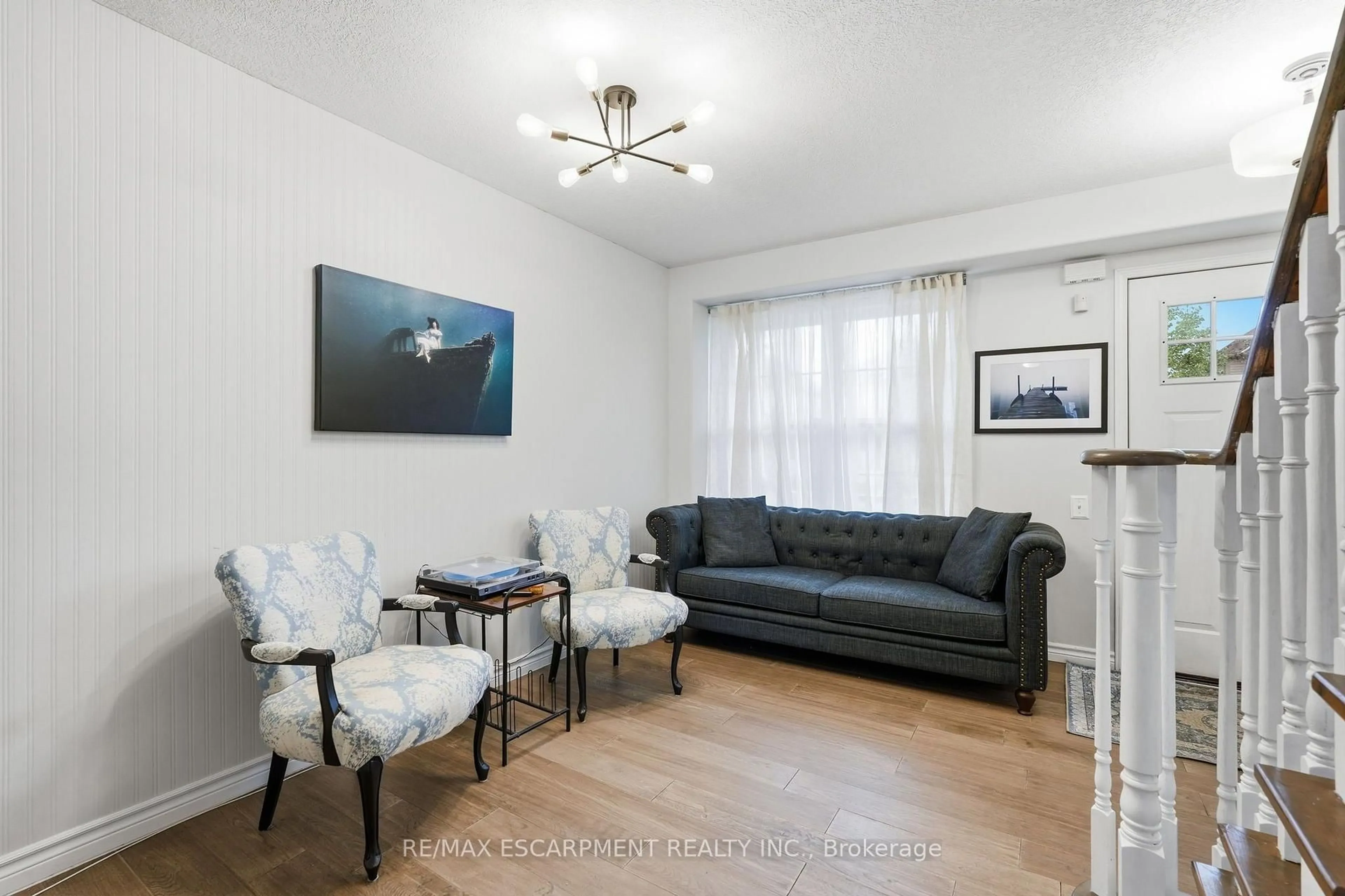 Living room with furniture, wood/laminate floor for 141 Cleghorn Dr, Hamilton Ontario L0R 1C0
