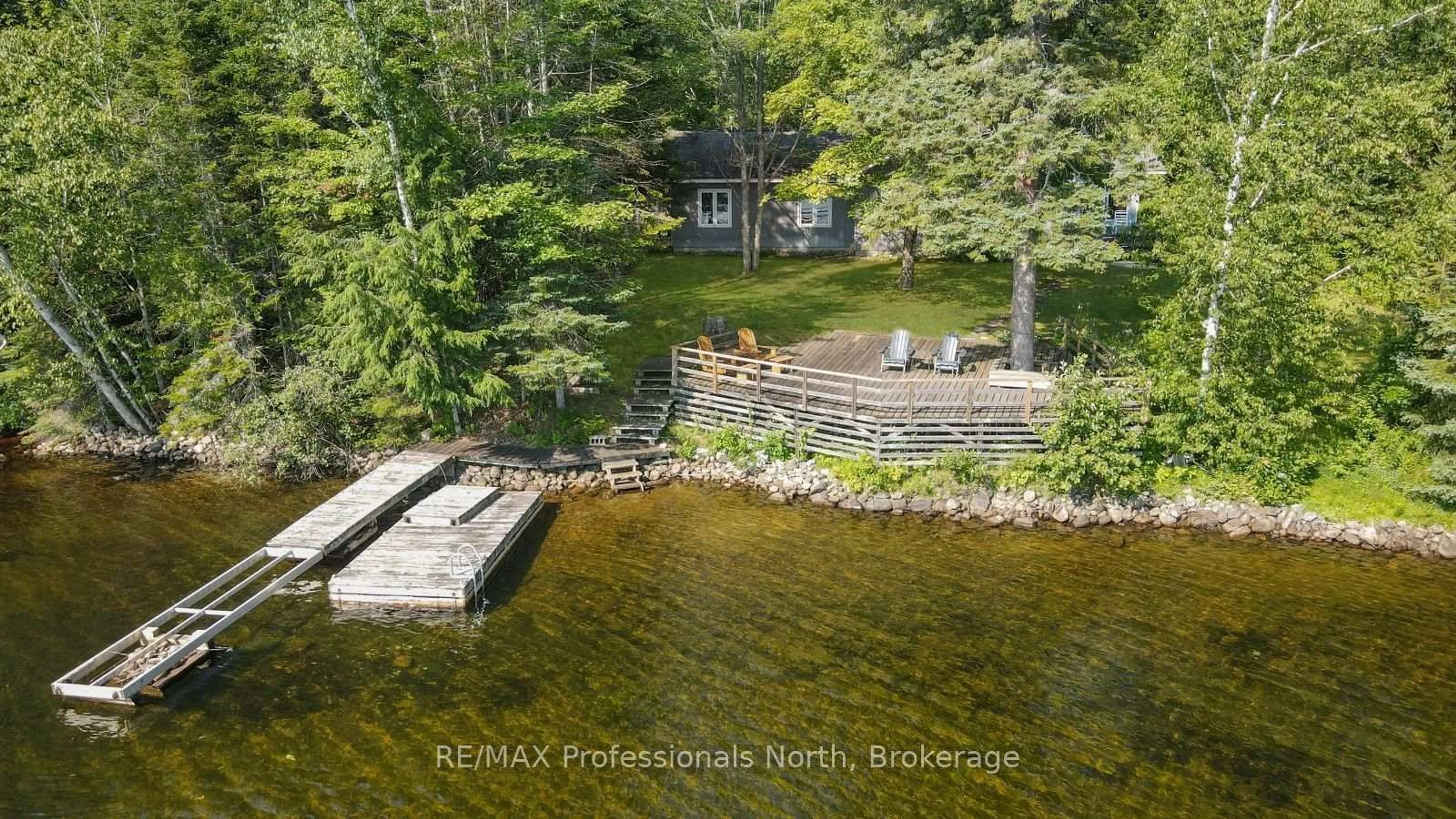 A pic from outside/outdoor area/front of a property/back of a property/a pic from drone, water/lake/river/ocean view for 1500 Twelve Mile Lake Rd, Minden Hills Ontario K0M 2K0