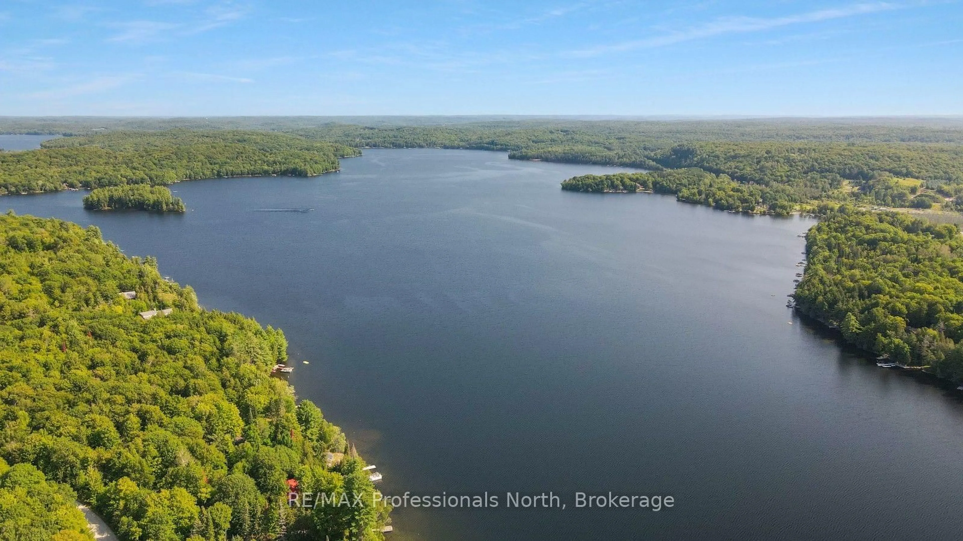 A pic from outside/outdoor area/front of a property/back of a property/a pic from drone, water/lake/river/ocean view for 1500 Twelve Mile Lake Rd, Minden Hills Ontario K0M 2K0