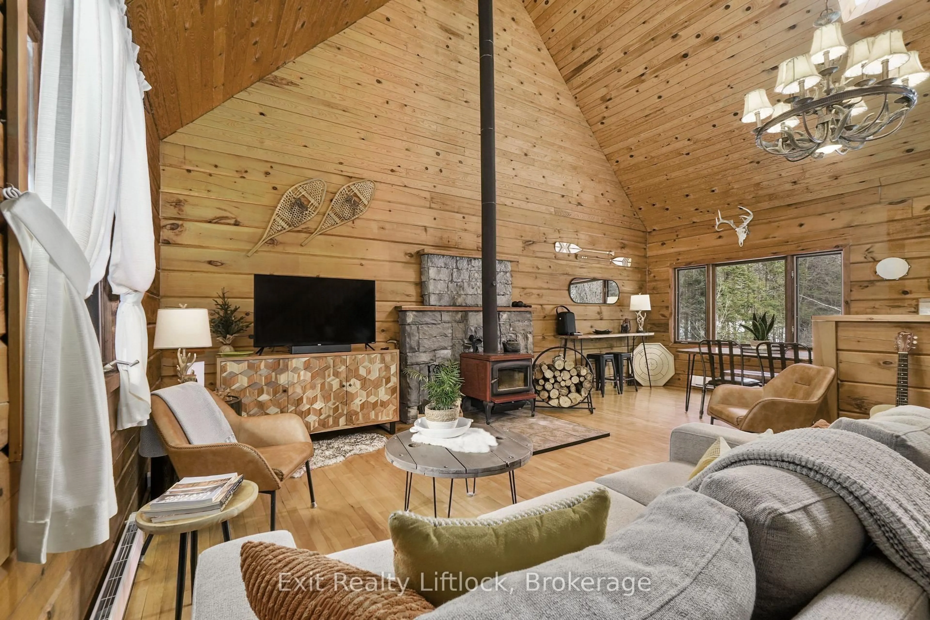 Living room with furniture, wood/laminate floor for 3428 County Rd 620, North Kawartha Ontario K0L 1A0