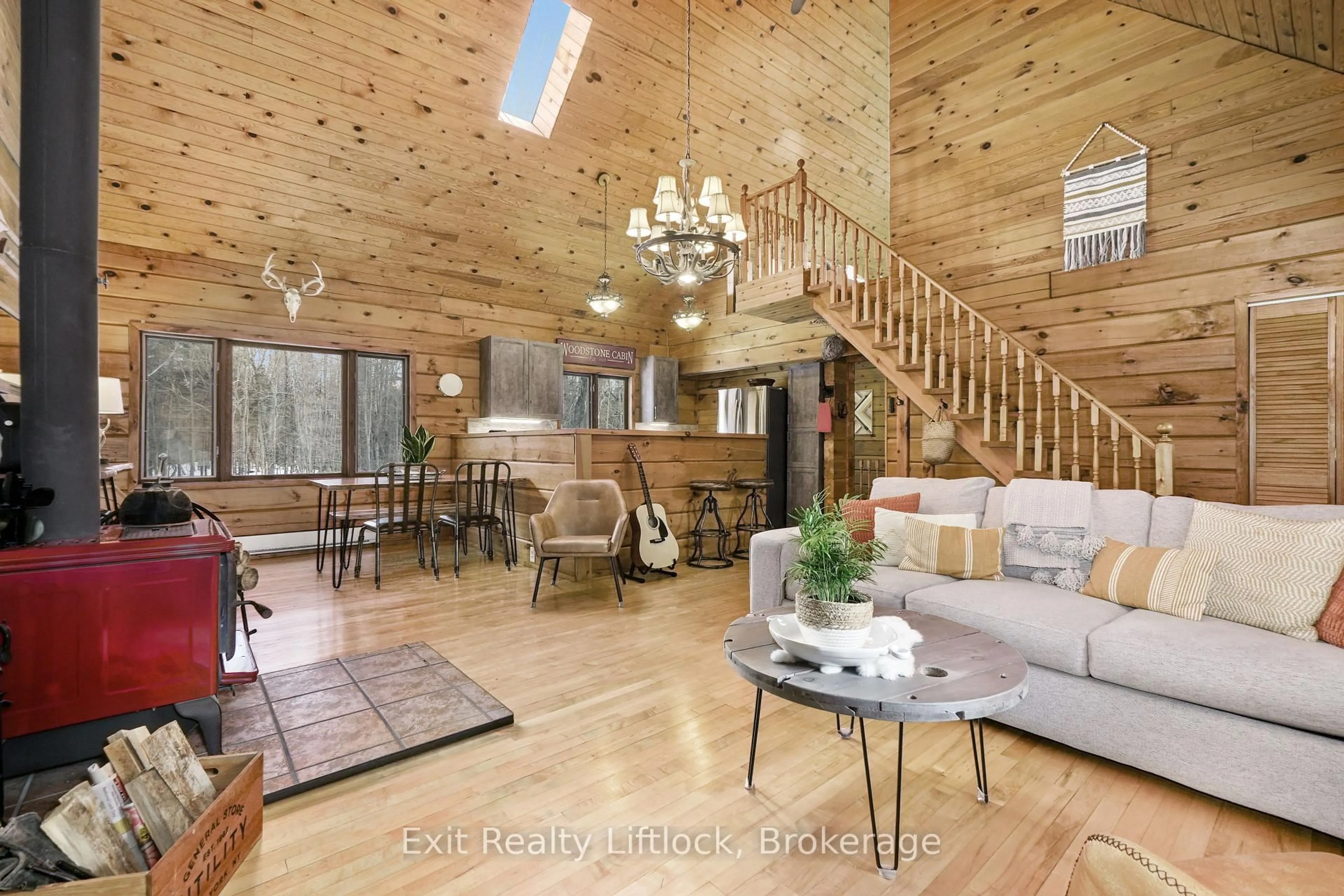 Living room with furniture, wood/laminate floor for 3428 County Rd 620, North Kawartha Ontario K0L 1A0