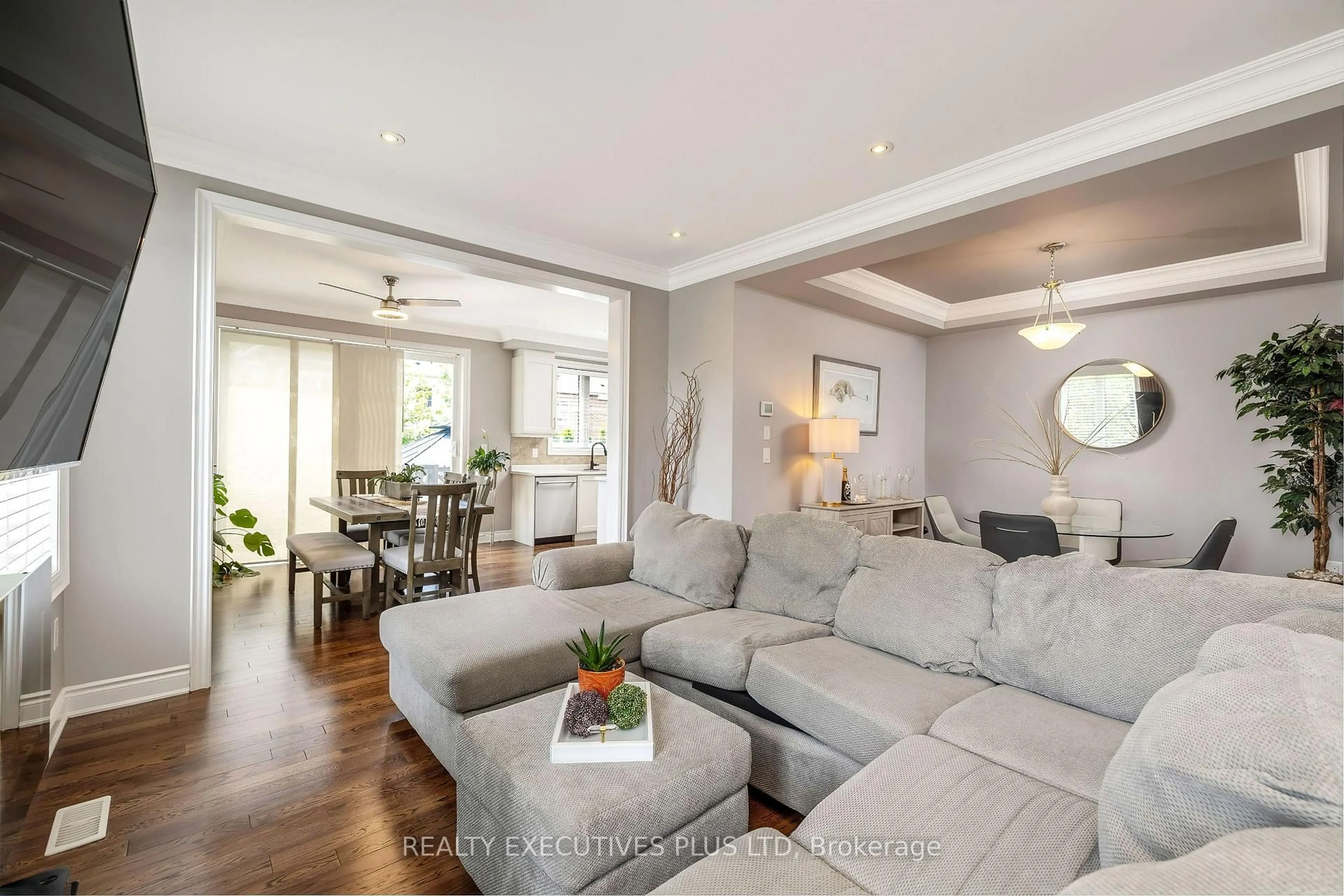 Living room with furniture, wood/laminate floor for 86 Stillwater Cres, Hamilton Ontario L0R 2H8