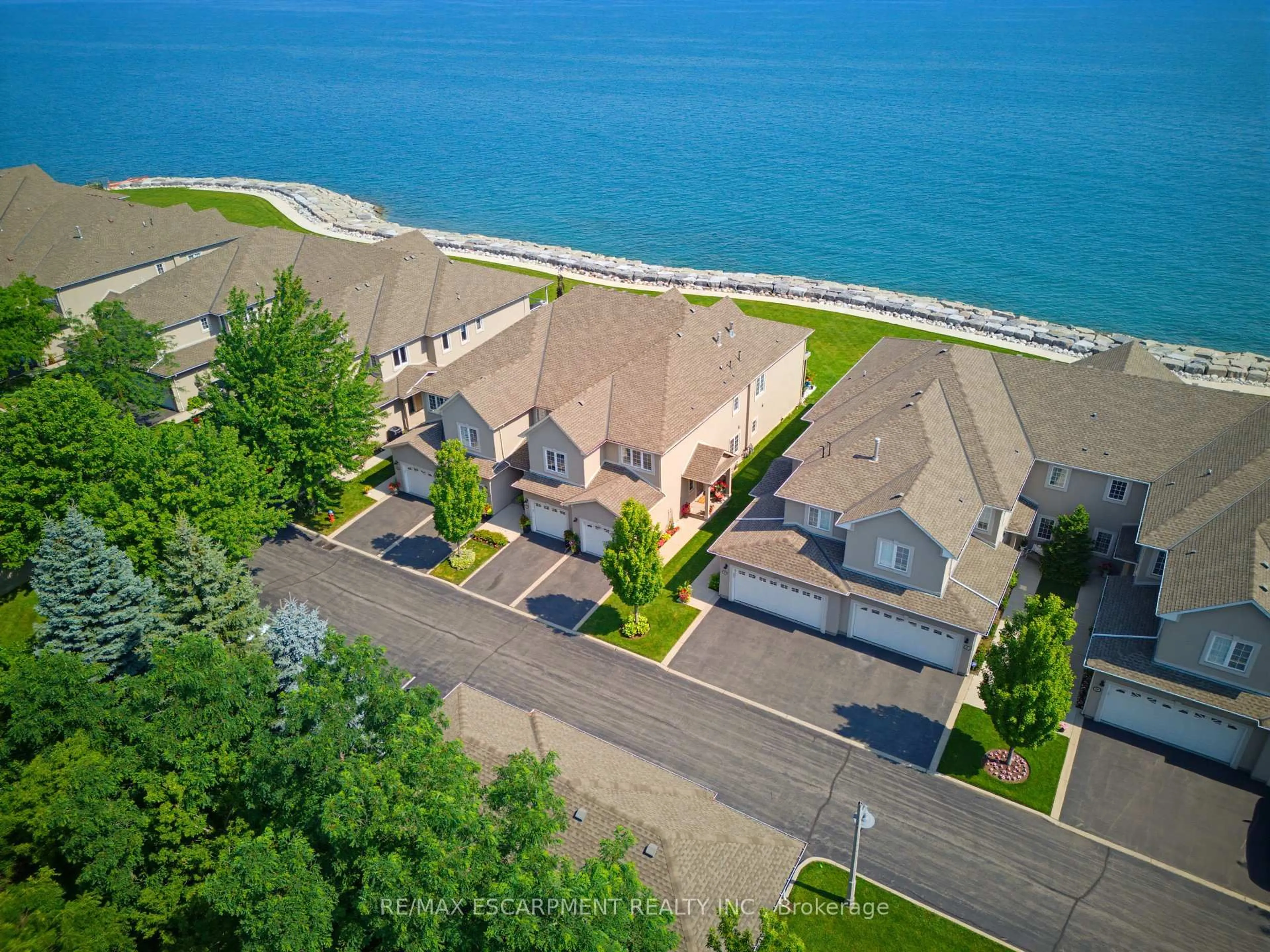 A pic from outside/outdoor area/front of a property/back of a property/a pic from drone, water/lake/river/ocean view for 484 Millen Rd #15, Hamilton Ontario L8E 6G4
