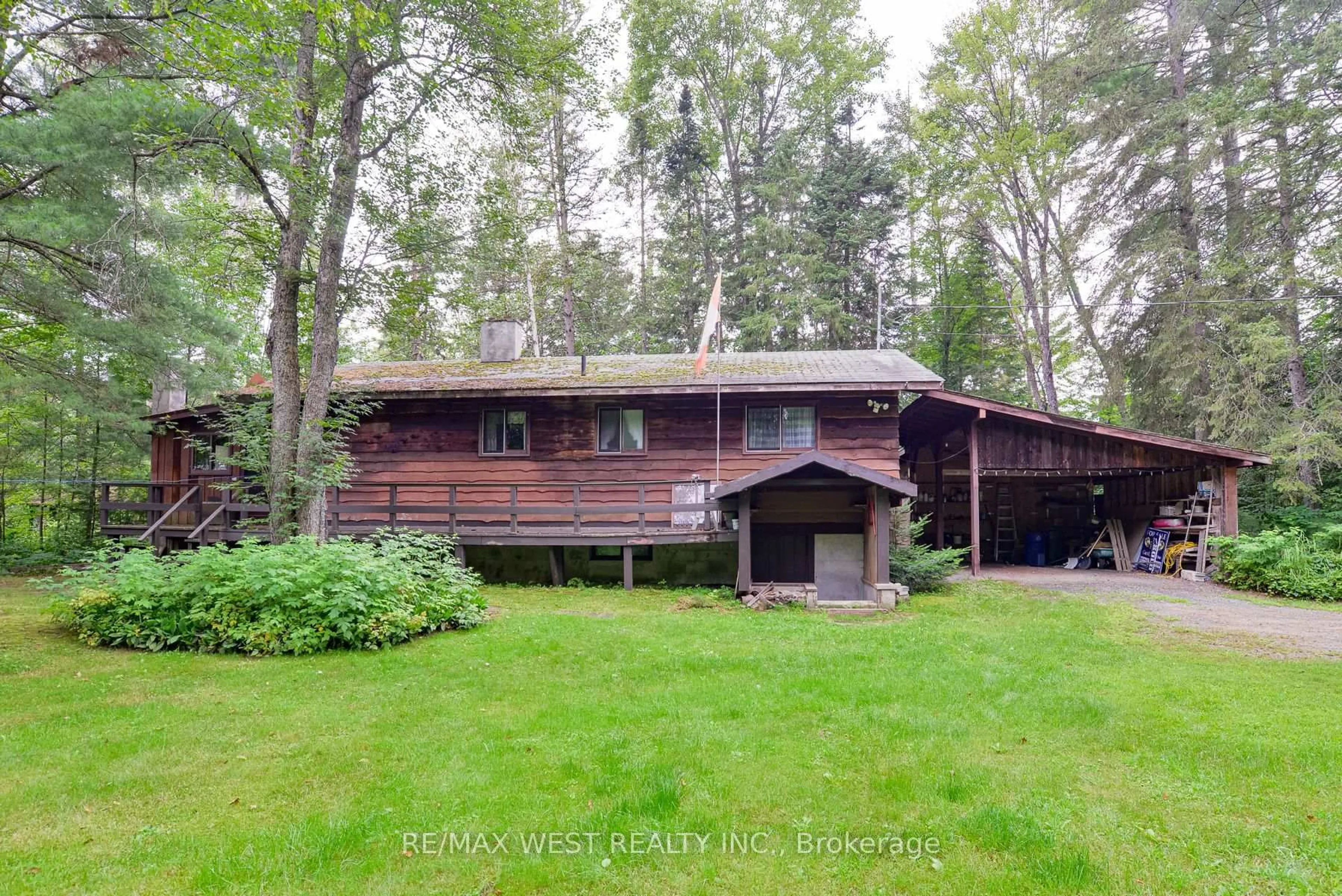 A pic from outside/outdoor area/front of a property/back of a property/a pic from drone, forest/trees view for 52 Robert Rd, Huntsville Ontario P1H 2J4
