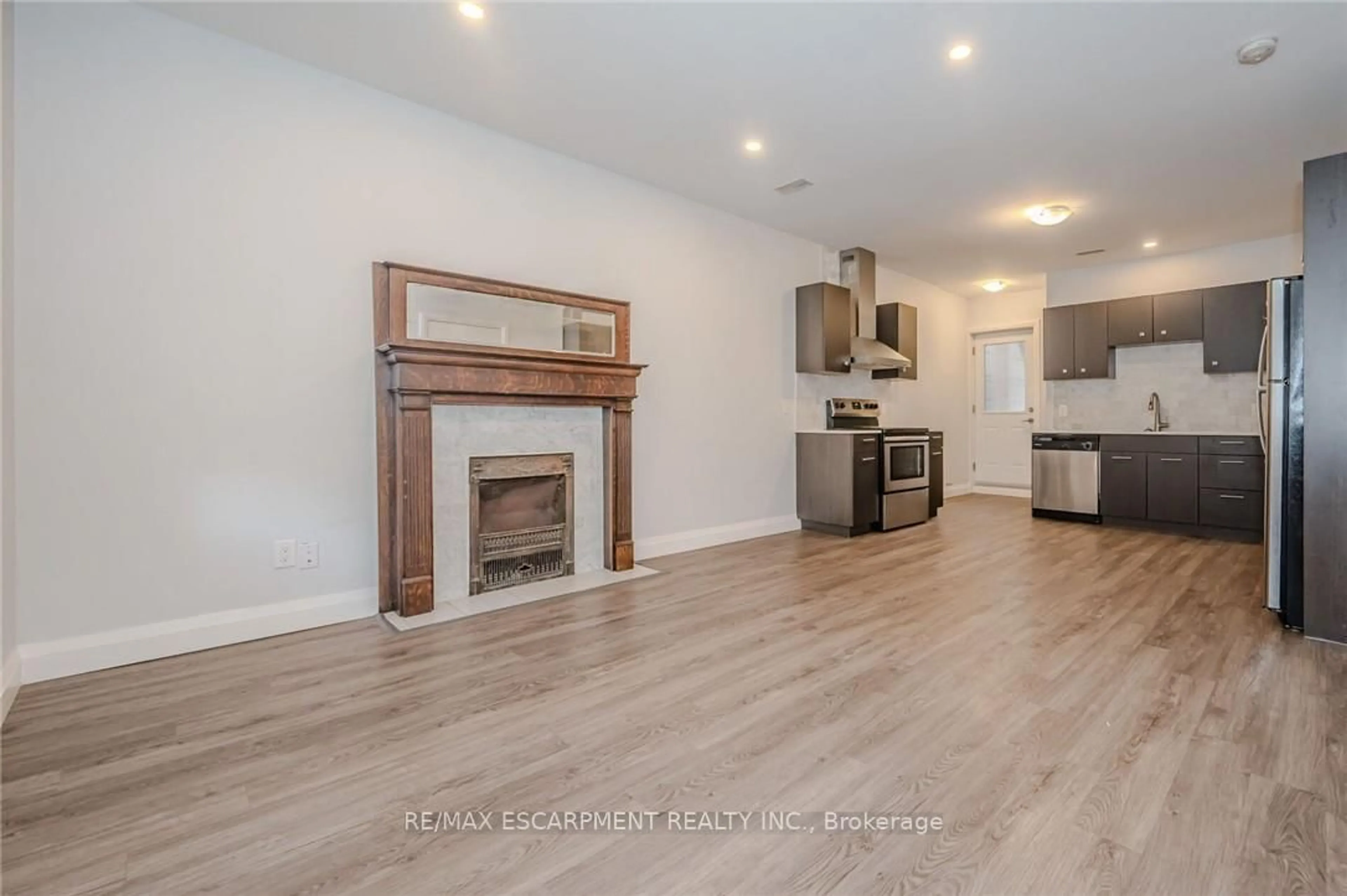 Open concept kitchen, wood/laminate floor for 74 Cathcart St, Hamilton Ontario L8R 1M5