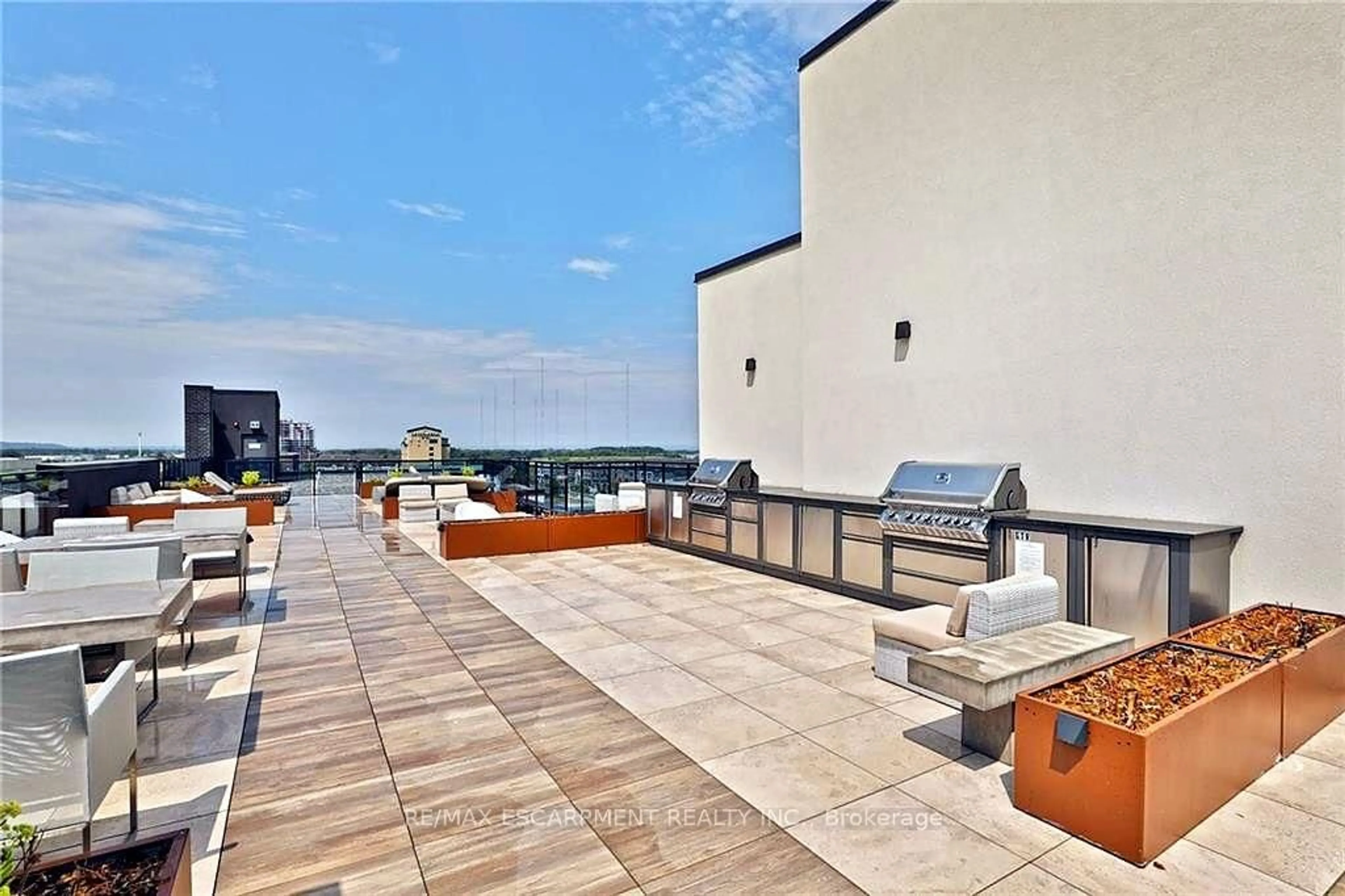 Patio, city buildings view from balcony for 10 CONCORD Pl #117, Grimsby Ontario L3M 0G6