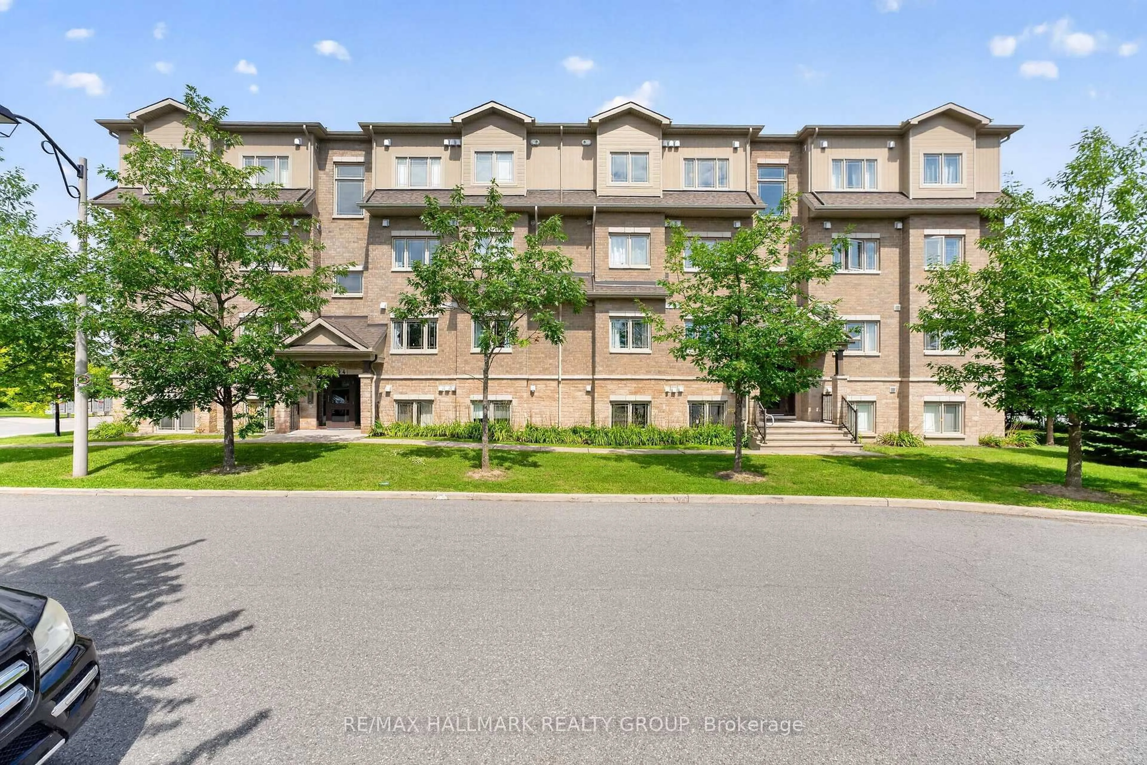 A pic from outside/outdoor area/front of a property/back of a property/a pic from drone, unknown for 192 Springbeauty Ave #7, Ottawa Ontario K2J 6B4