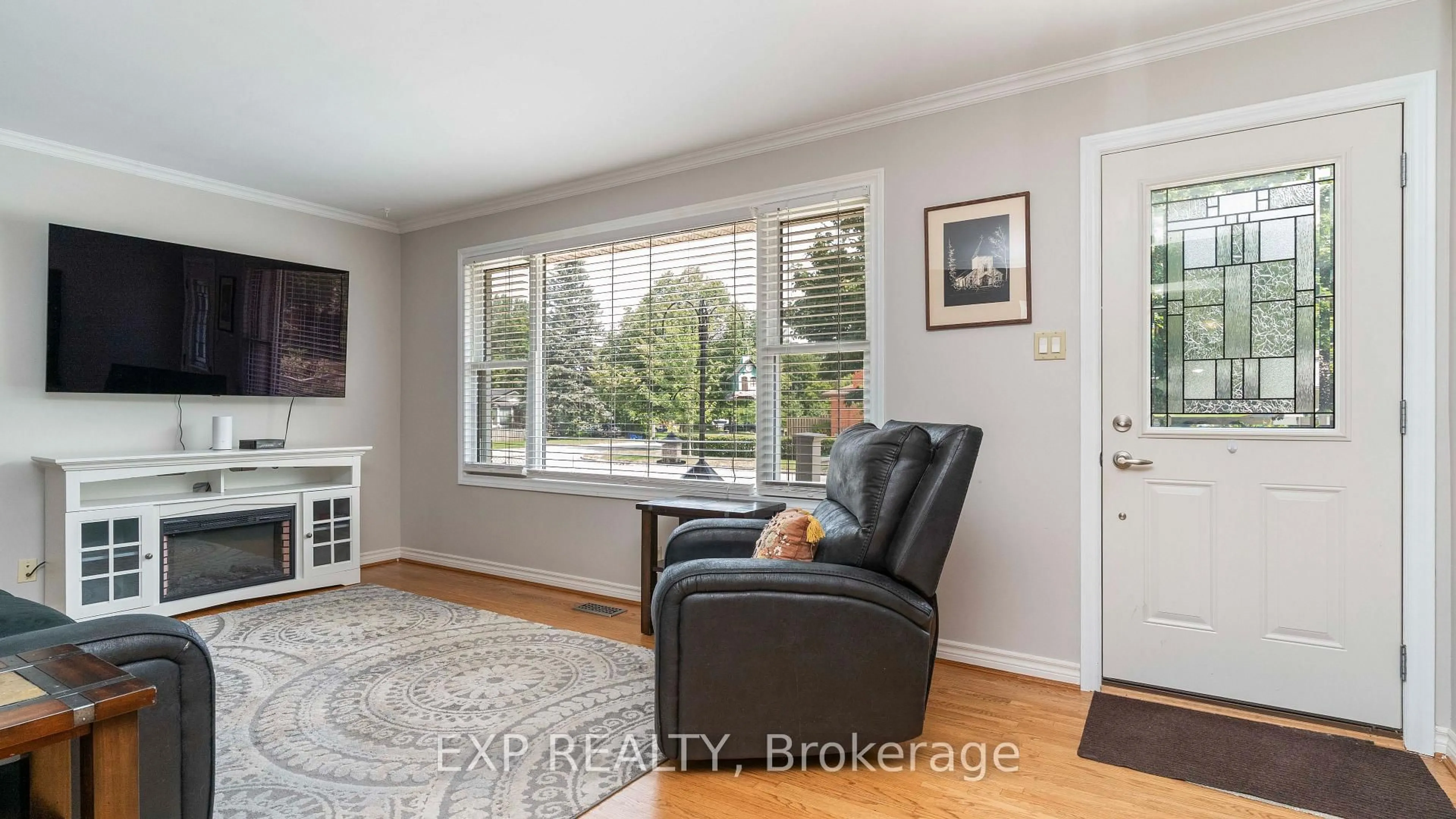 Living room with furniture, wood/laminate floor for 295 Tweedsmuir Ave, London East Ontario N5W 1L5