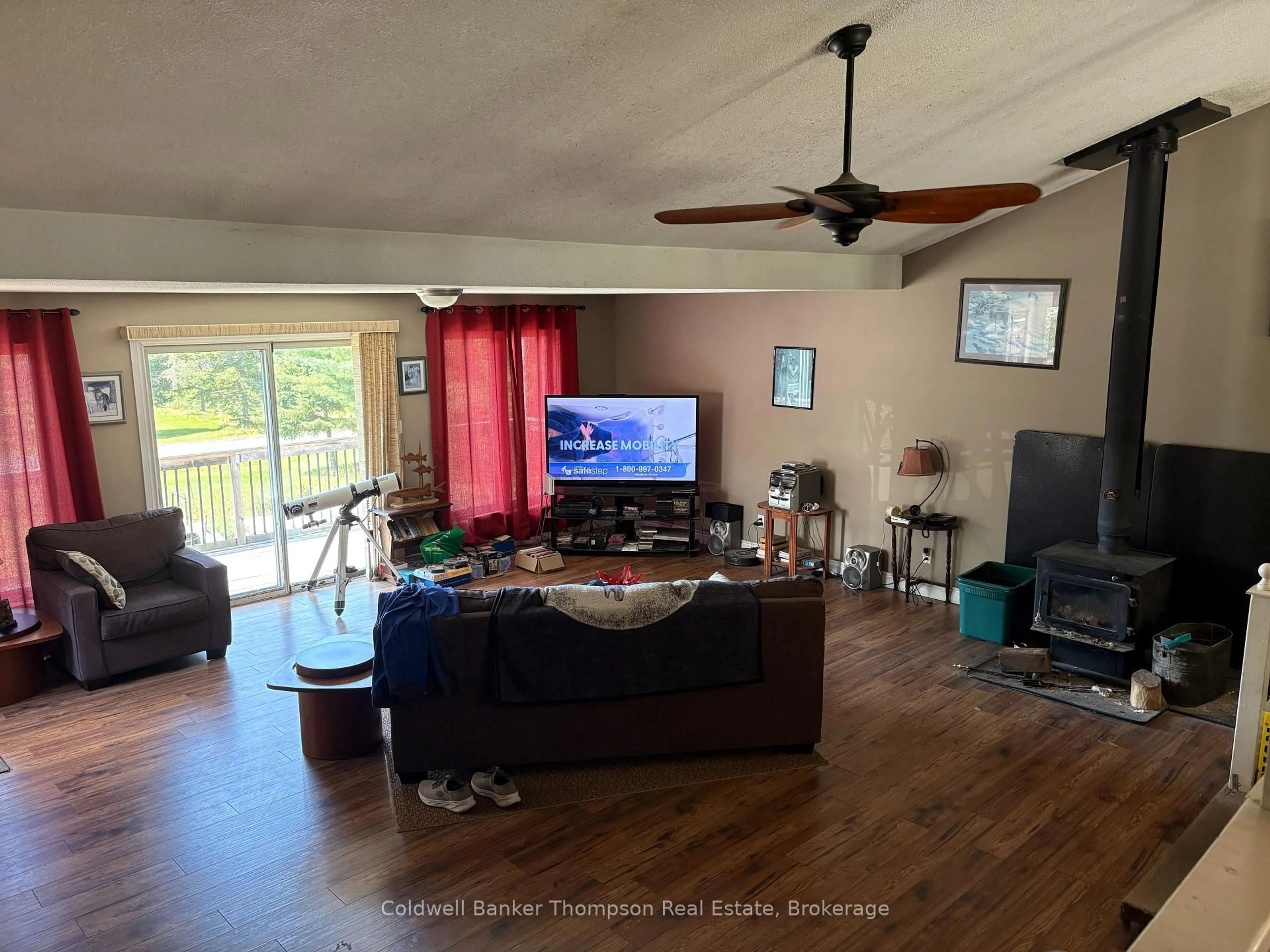 Living room with furniture, wood/laminate floor for 109 Patrick St, Magnetawan Ontario P0A 1P0
