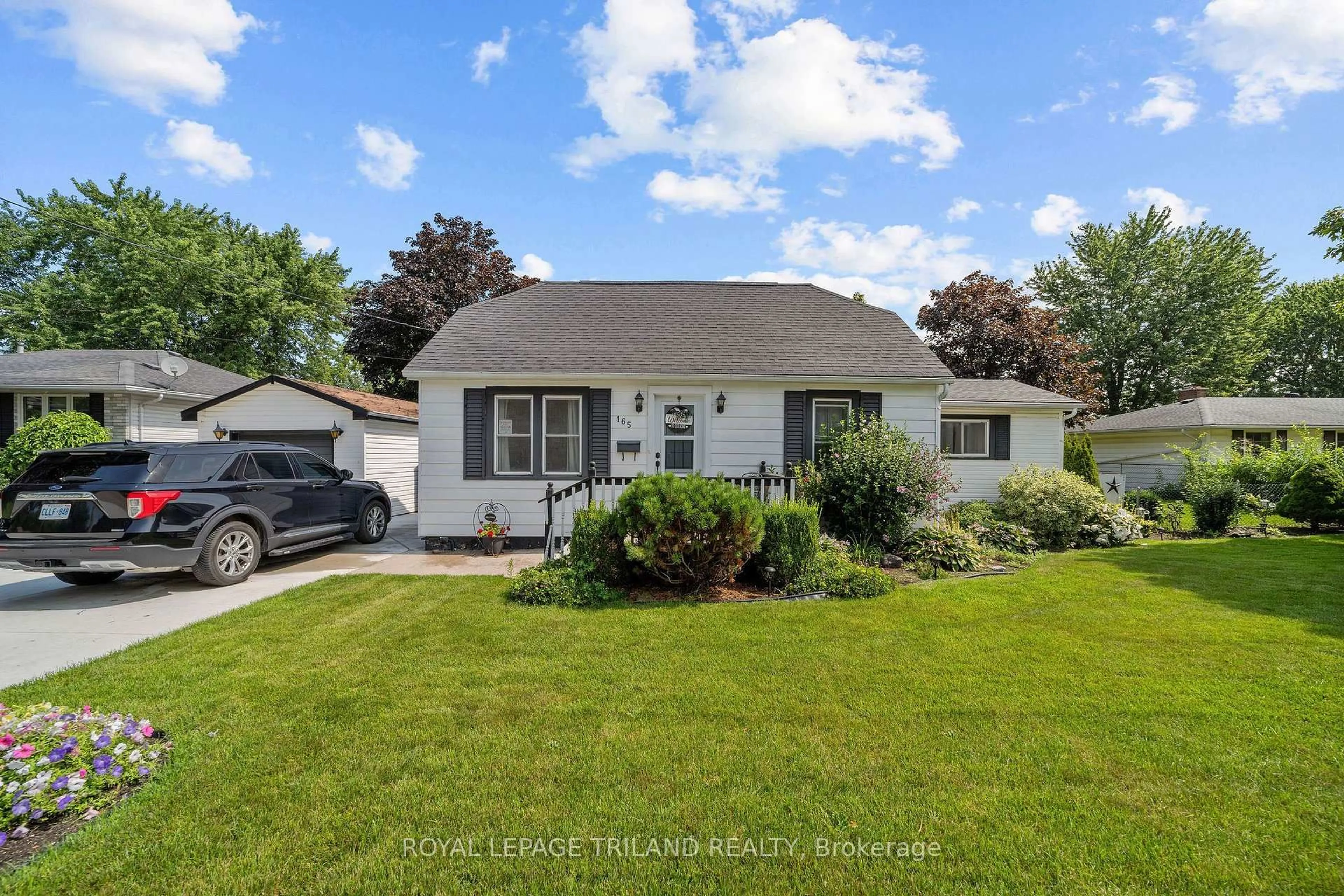 Home with vinyl exterior material, street for 165 Victoria St, Southwest Middlesex Ontario N0L 1M0