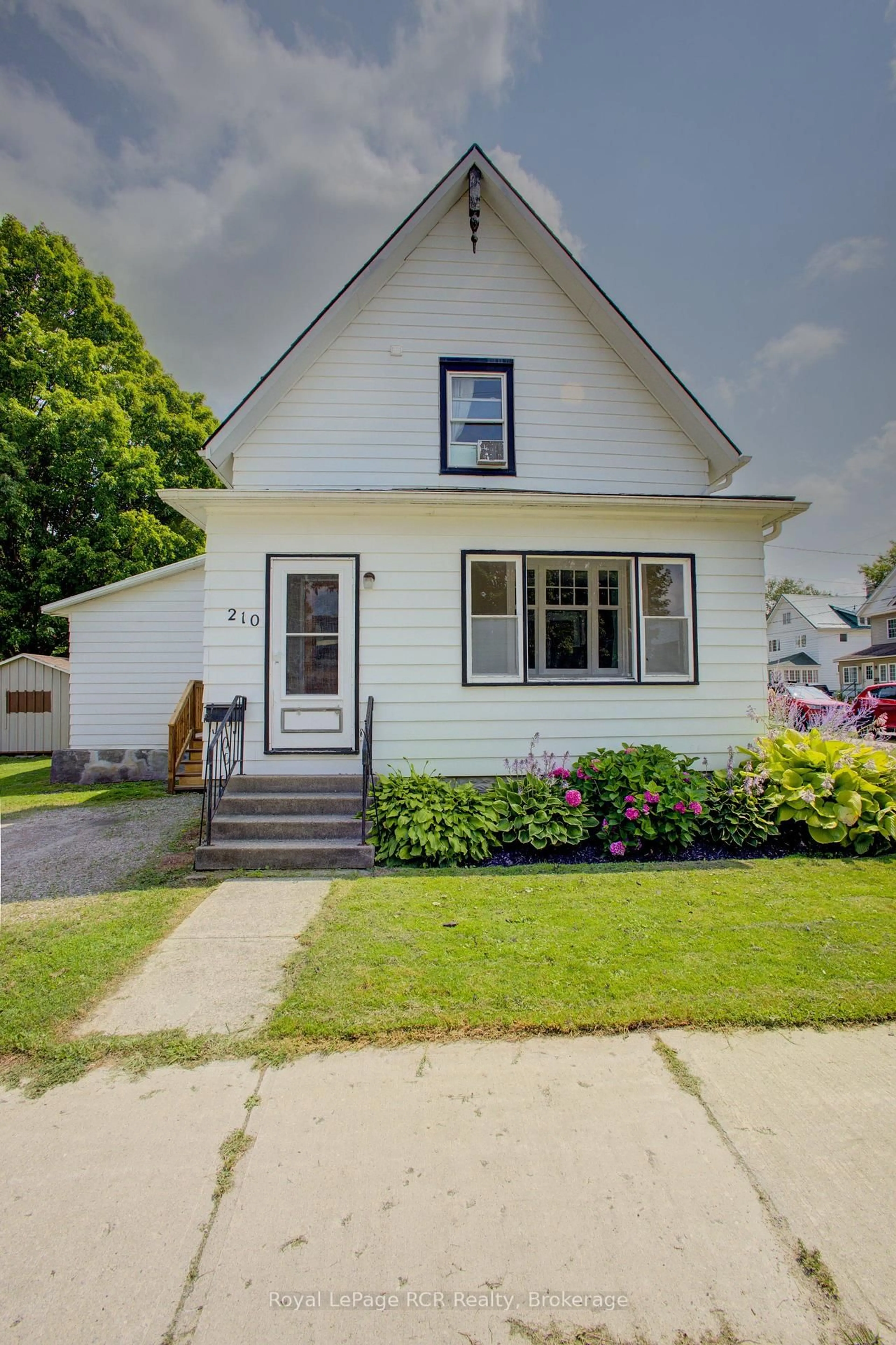 Home with vinyl exterior material, street for 210 Davidson Ave, North Perth Ontario N4W 3A4