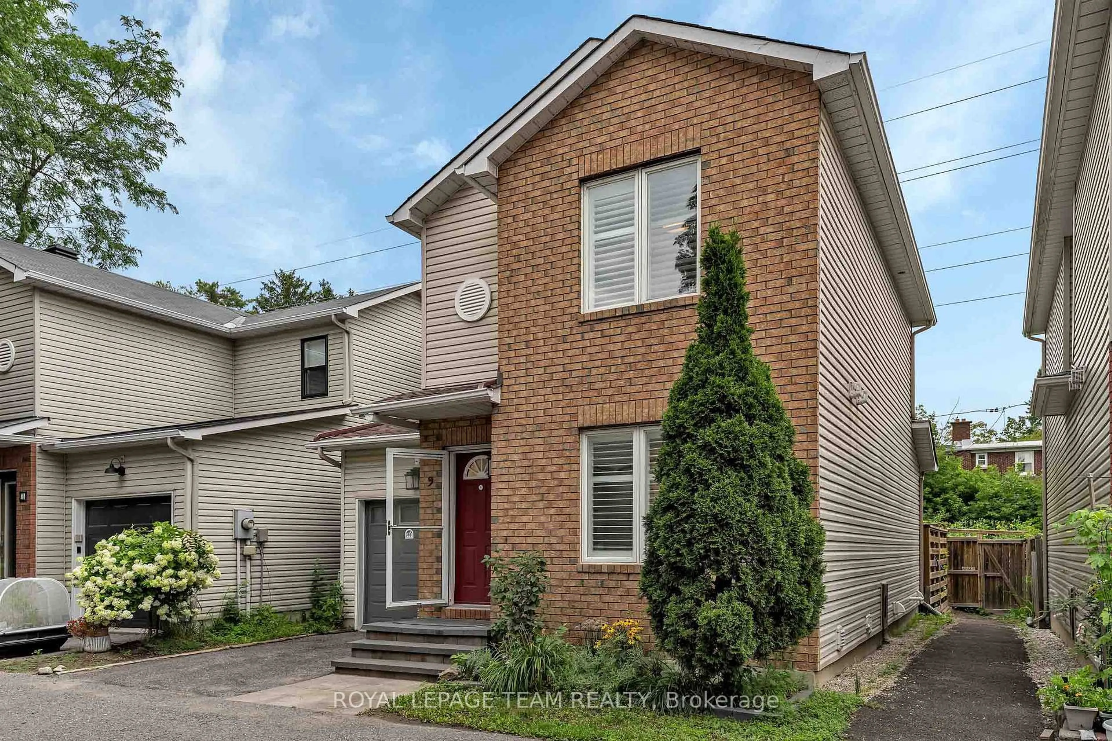 Home with brick exterior material, street for 583 Tweedsmuir Ave #9, Ottawa Ontario K1Z 5P4