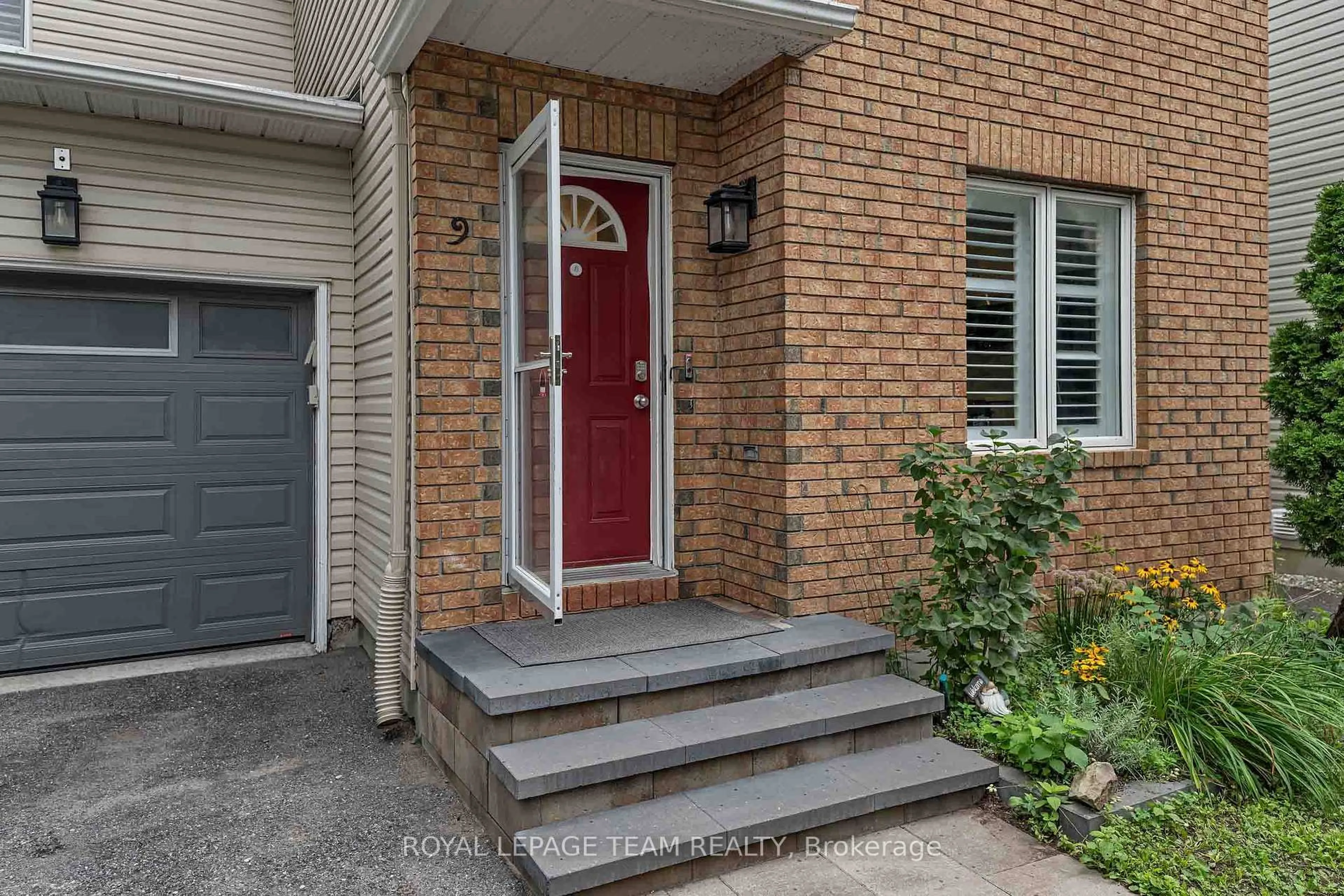Home with brick exterior material, street for 583 Tweedsmuir Ave #9, Ottawa Ontario K1Z 5P4