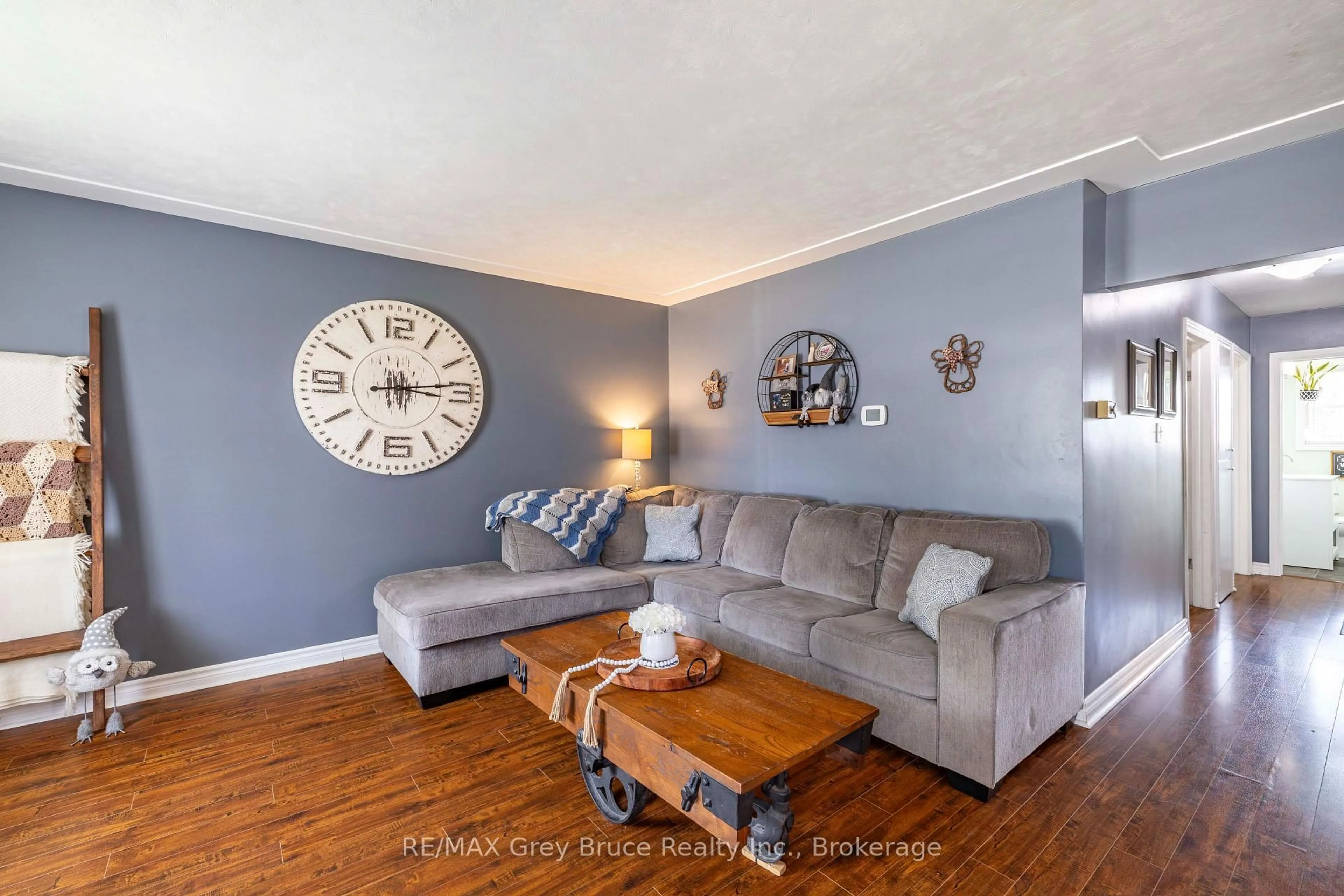 Living room with furniture, wood/laminate floor for 175 Fergus St, Wellington North Ontario N0G 2L0
