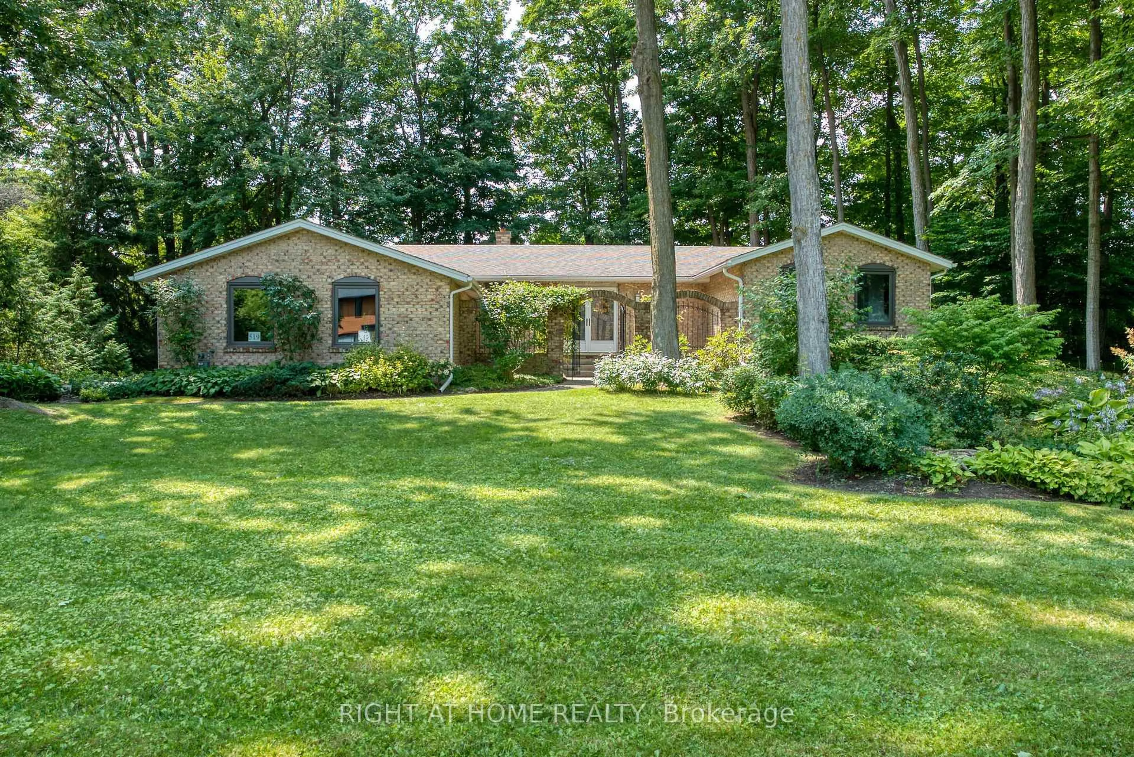 Home with brick exterior material, forest/trees view for 519 Oxbow Rd, Waterloo Ontario N2K 1Y5