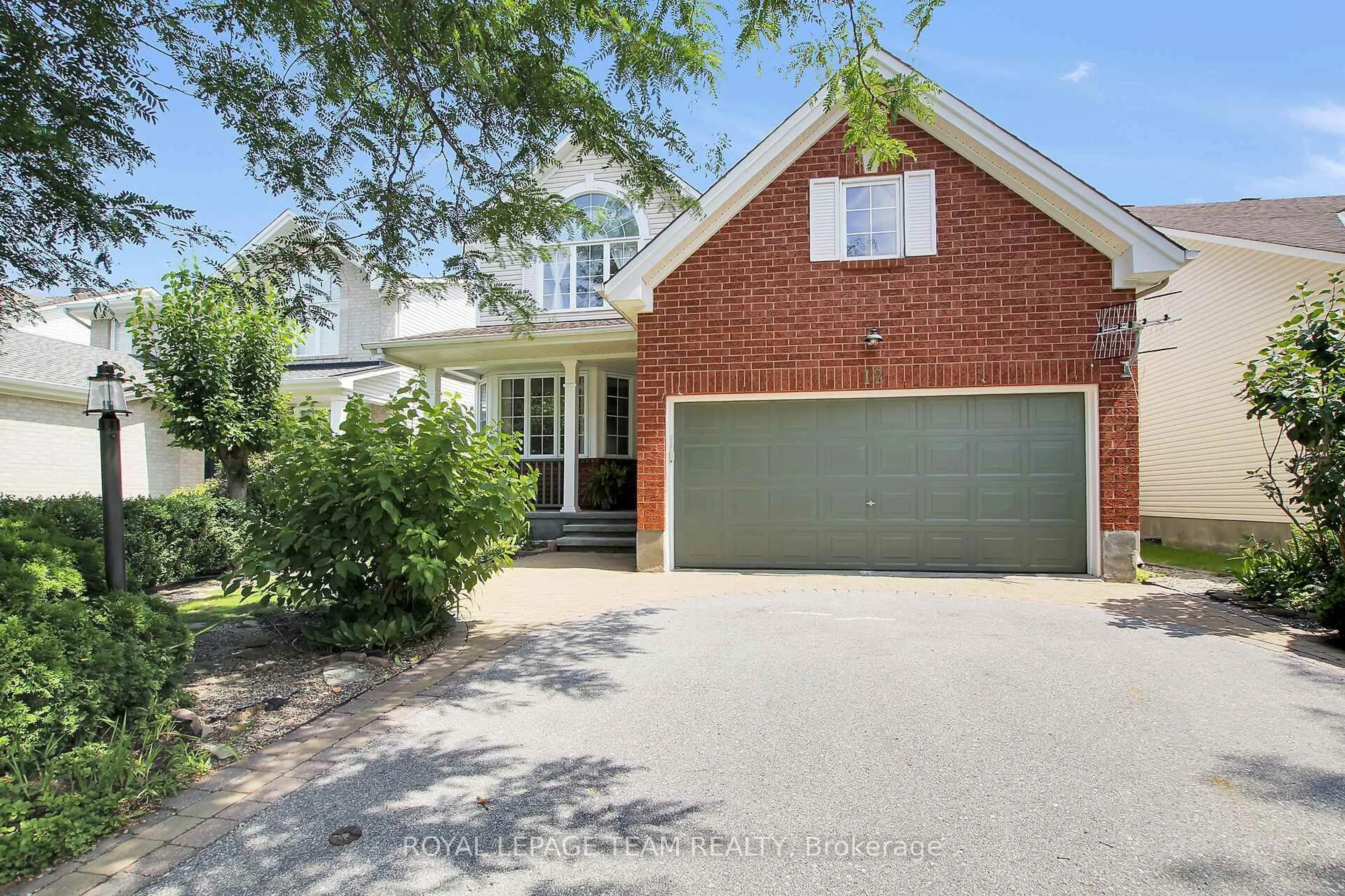 Home with brick exterior material, street for 12 Mattawa Cres, Ottawa Ontario K2M 2J4