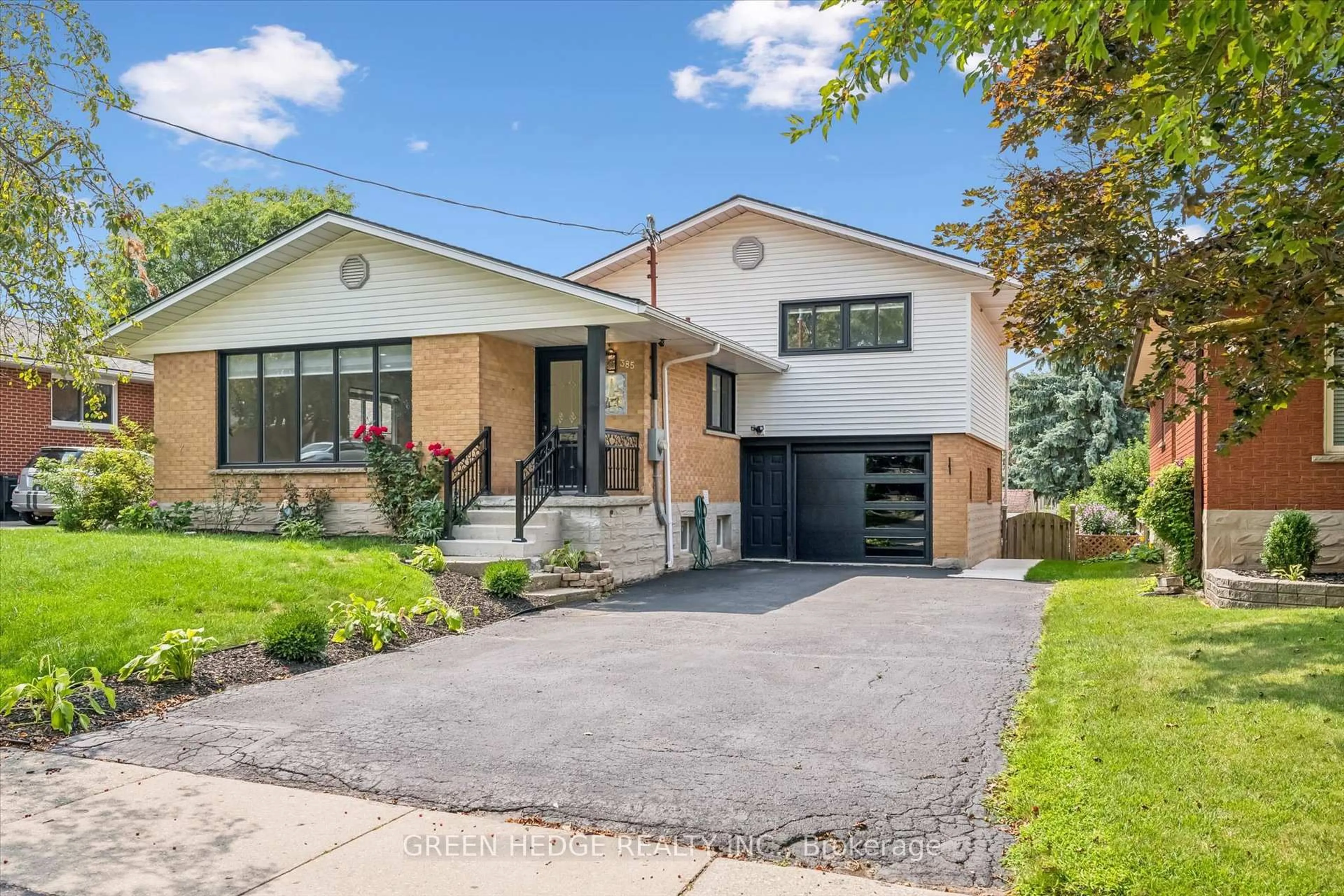 Home with brick exterior material, street for 385 Village Cres, Kitchener Ontario N2M 4V2