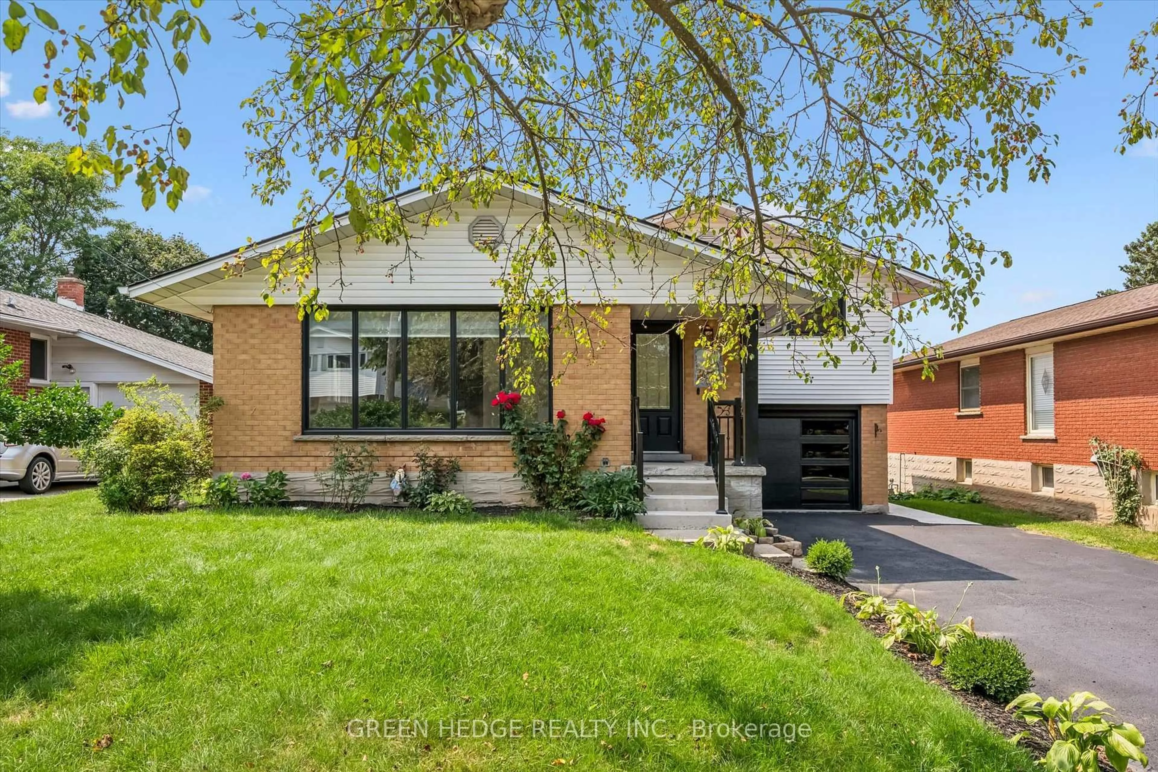 Home with brick exterior material, street for 385 Village Cres, Kitchener Ontario N2M 4V2