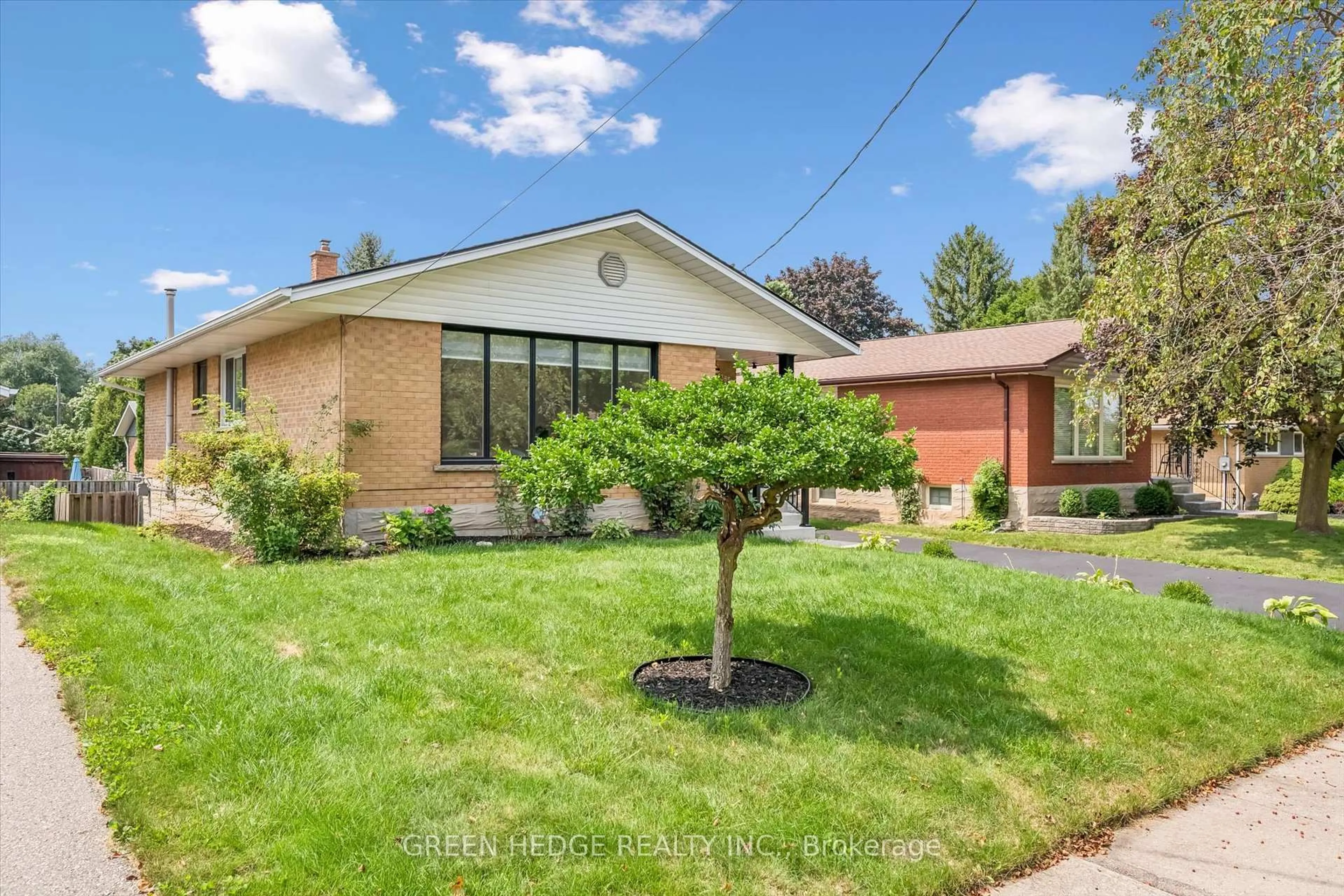 Home with brick exterior material, street for 385 Village Cres, Kitchener Ontario N2M 4V2