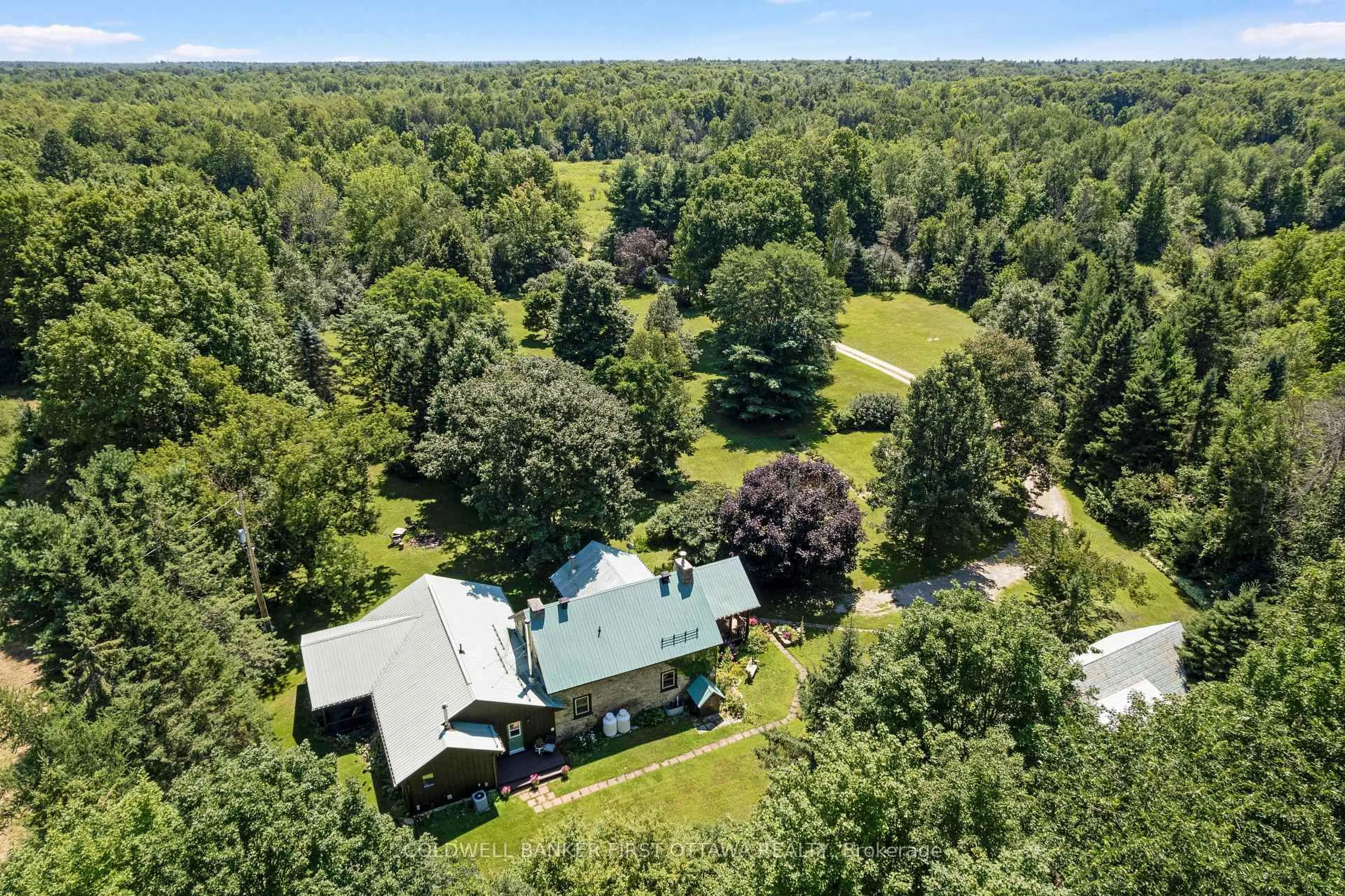 A pic from outside/outdoor area/front of a property/back of a property/a pic from drone, forest/trees view for 340 North Burgess 8th Concession, Perth Ontario K7H 0E5